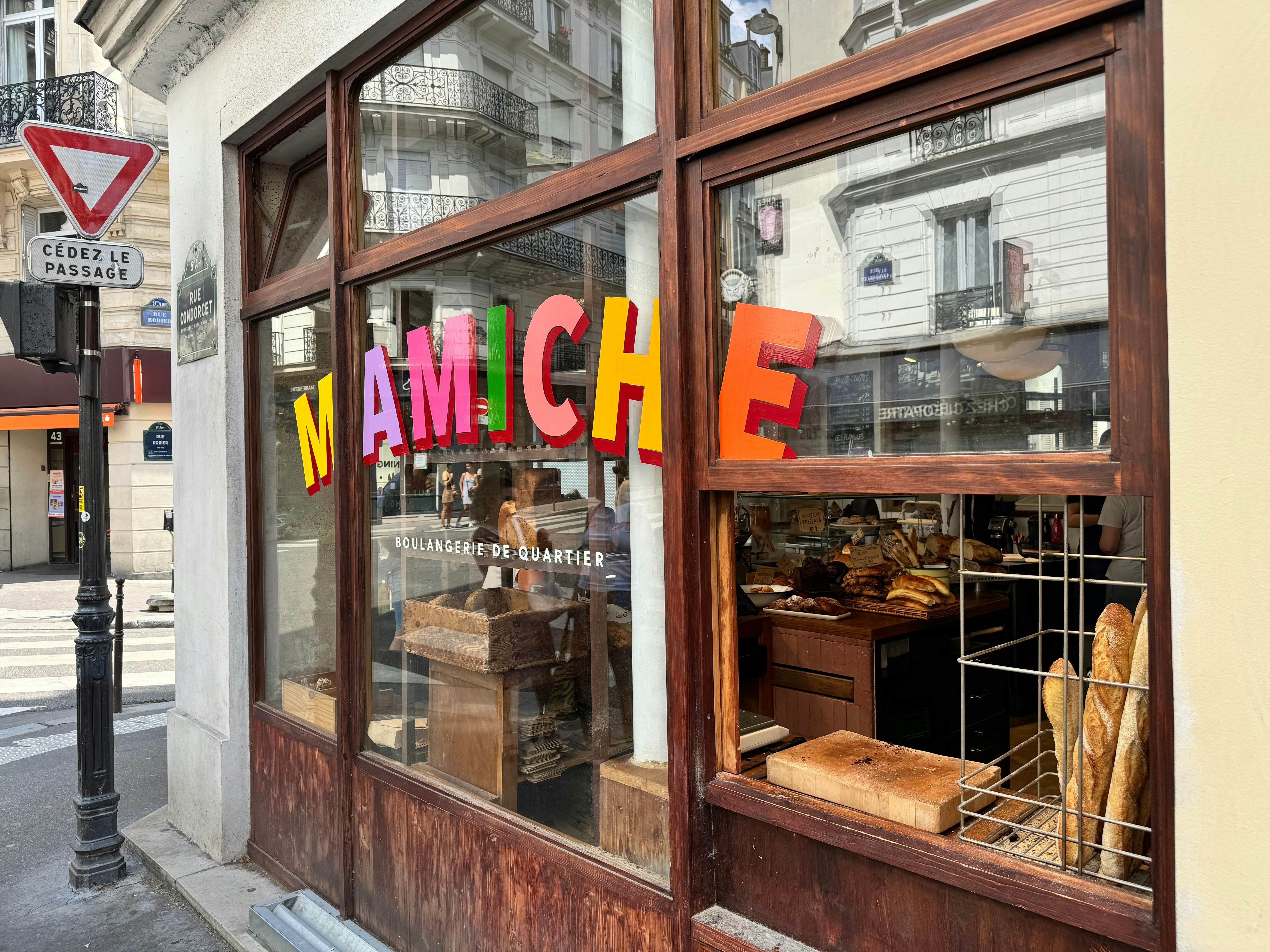 Paris, France - August 2, 2024 : Colorful sign with pink, purple, yellow, orange and green letters on the glass window of Mamiche boulangerie in the 9th arrondissement in Paris, License Type: media, Download Time: 2026-01-30T18:33:27.000Z, User: LP_NGMcElroy, Editorial: true, purchase_order: 65050 - Digital Destinations and Articles, job: Lonely Planet digital , client: Lonely Planet digital content, other: Nicole McElroy