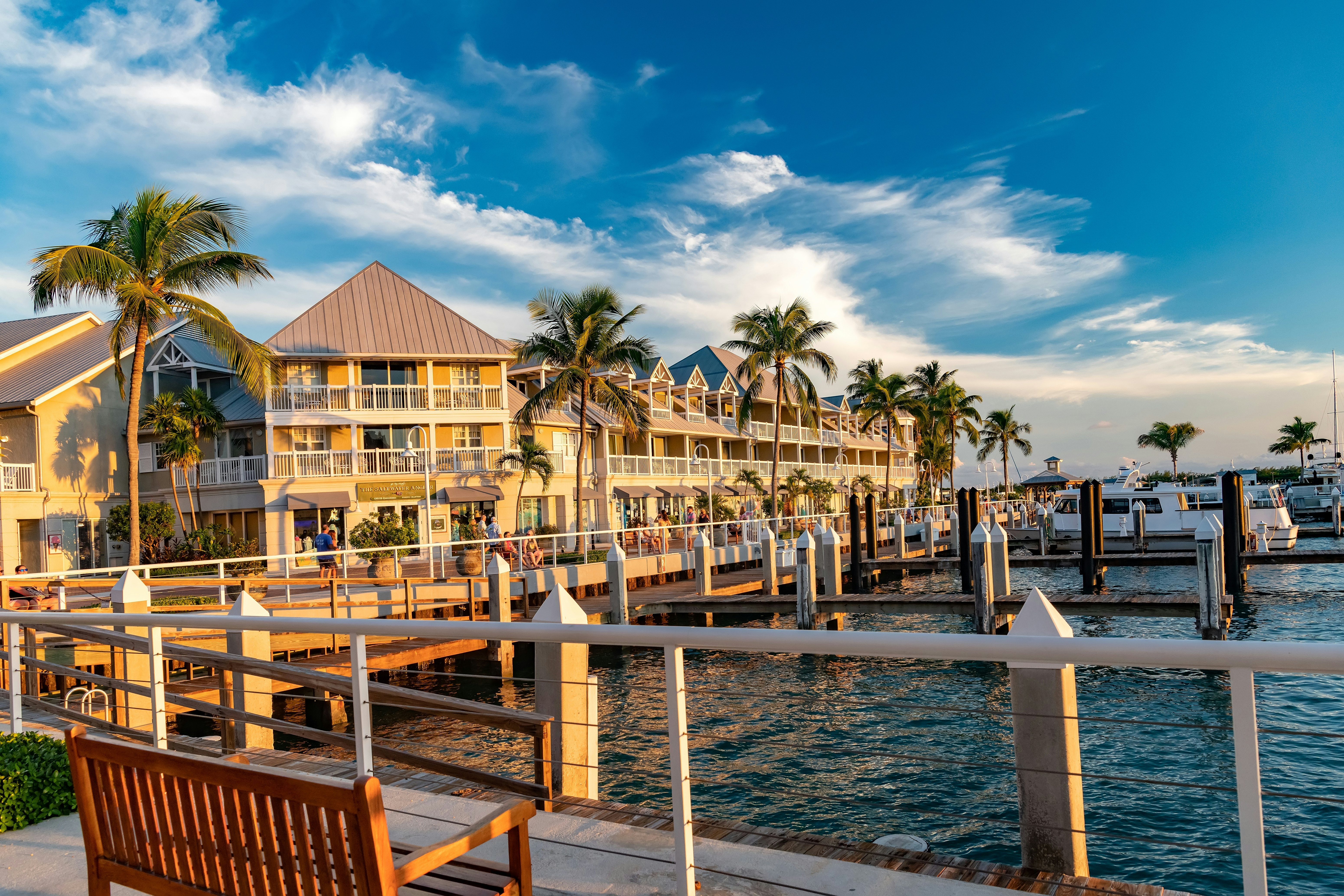 Sunset glow on an oceanfront hotel and docked boats in Key West