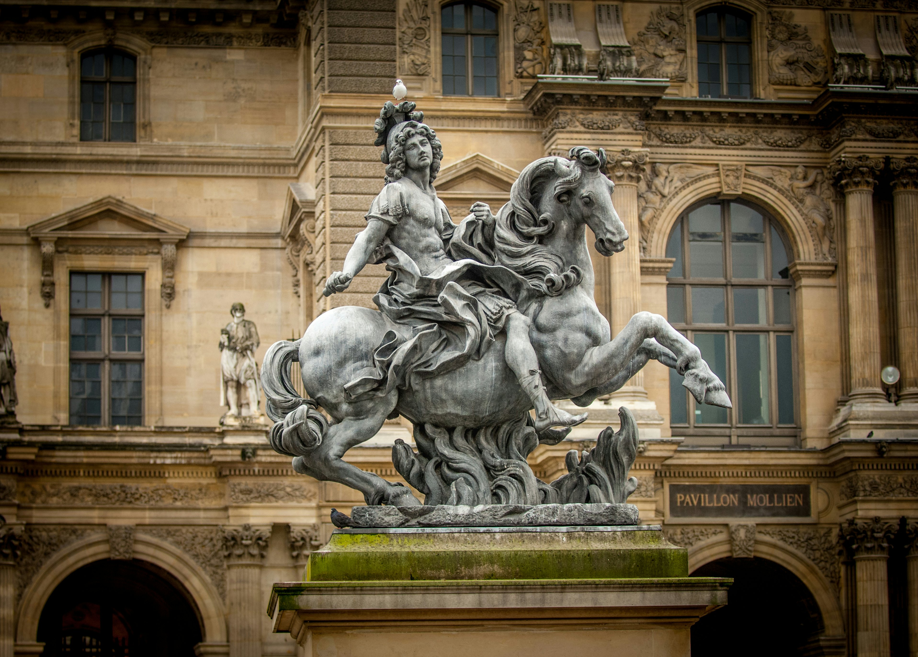 Statue of Louis XIV outside the Louvre, Paris, France.