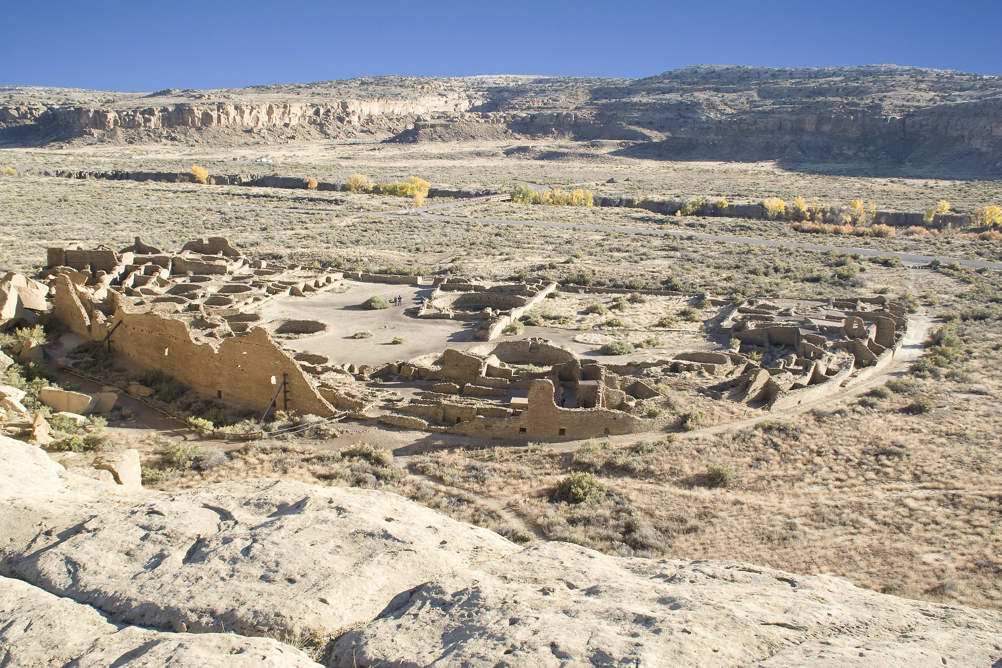 Ruins of an ancient village in a dry desert plain in New Mexico.