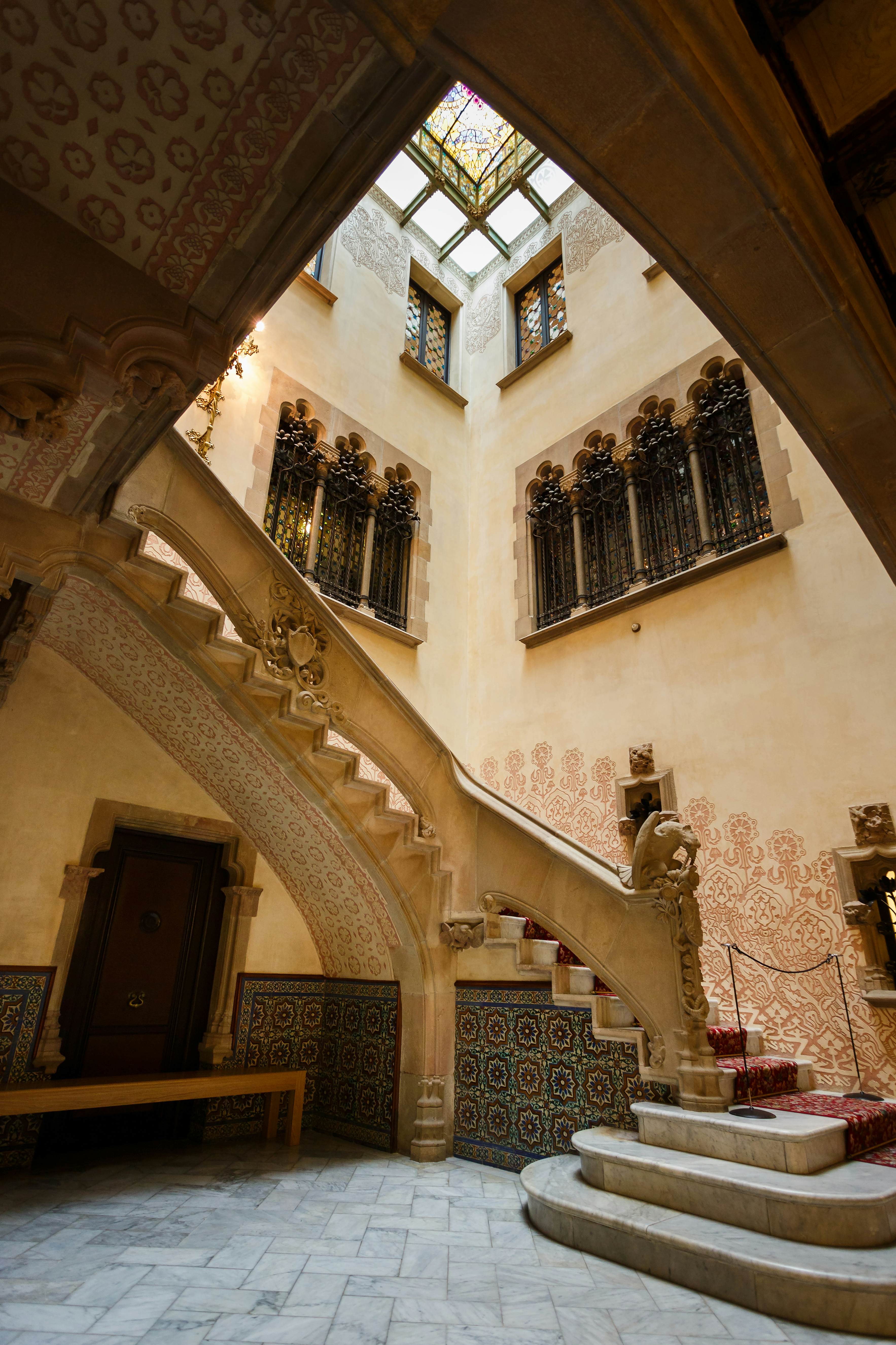 A stairwell with a decorative pattern along the wall.