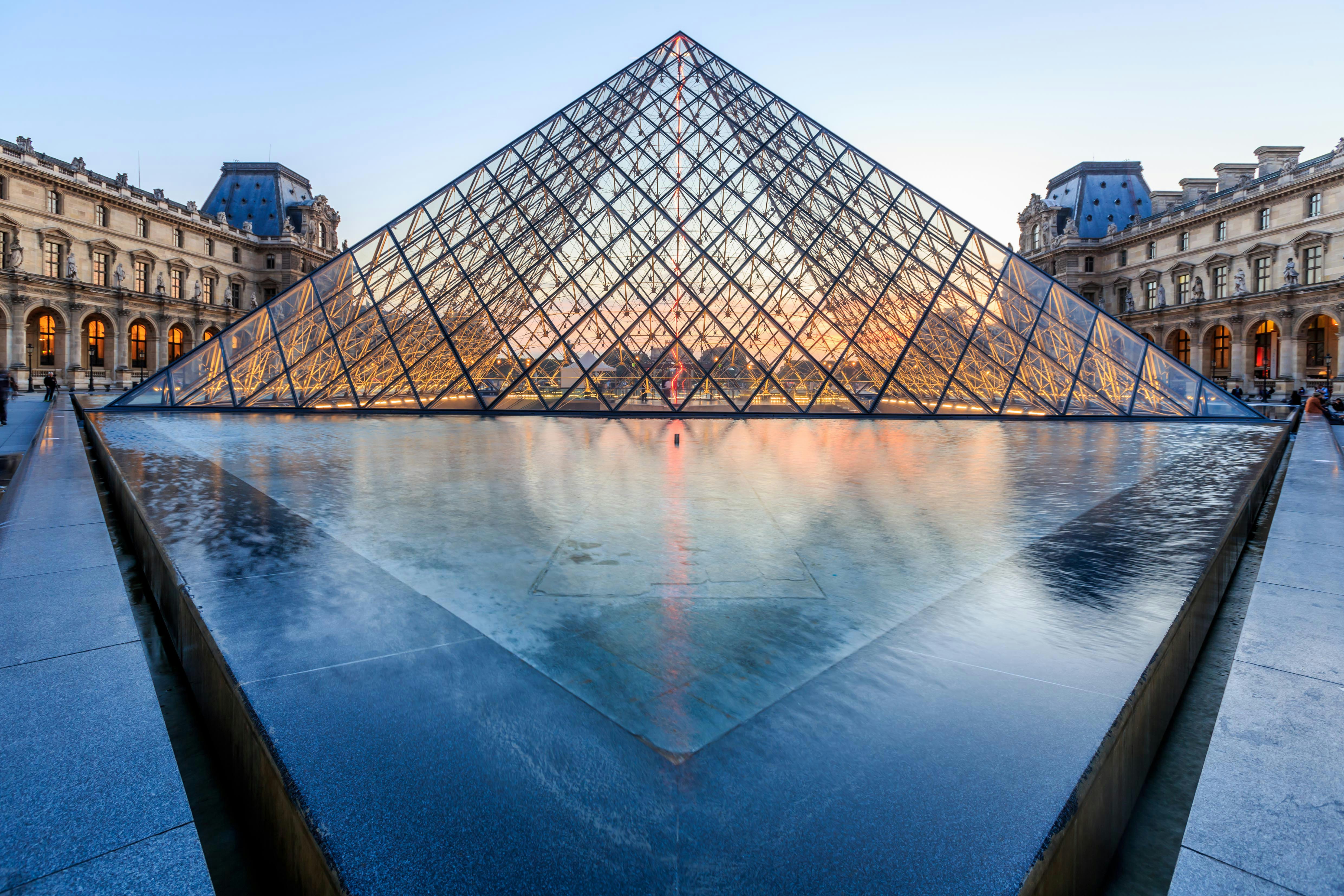 The large glass-and-metal pyramid-shaped structure that acts as the entrance to the Louvre.