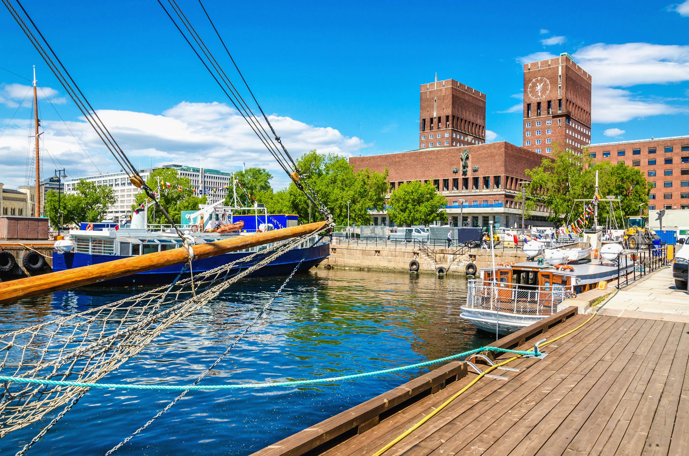 The Oslo City Hall seen from Oslo Harbor, Oslo Fjord, Norway.
320378477
outdoor, metropolitan, coast, town, white, travel, view, pier, urban, landmark, quay, history, norway, skyline, summer, outside, port, ship, yacht, hall, building, oslo, modern, wall, wharf, opera, architecture, city, blue, monuments, marine, sky, boat, sea, fjord, wooden, beautiful, water, jetty, construction, scandinavia, europe, harbor, capital, radhuset, harbour, north