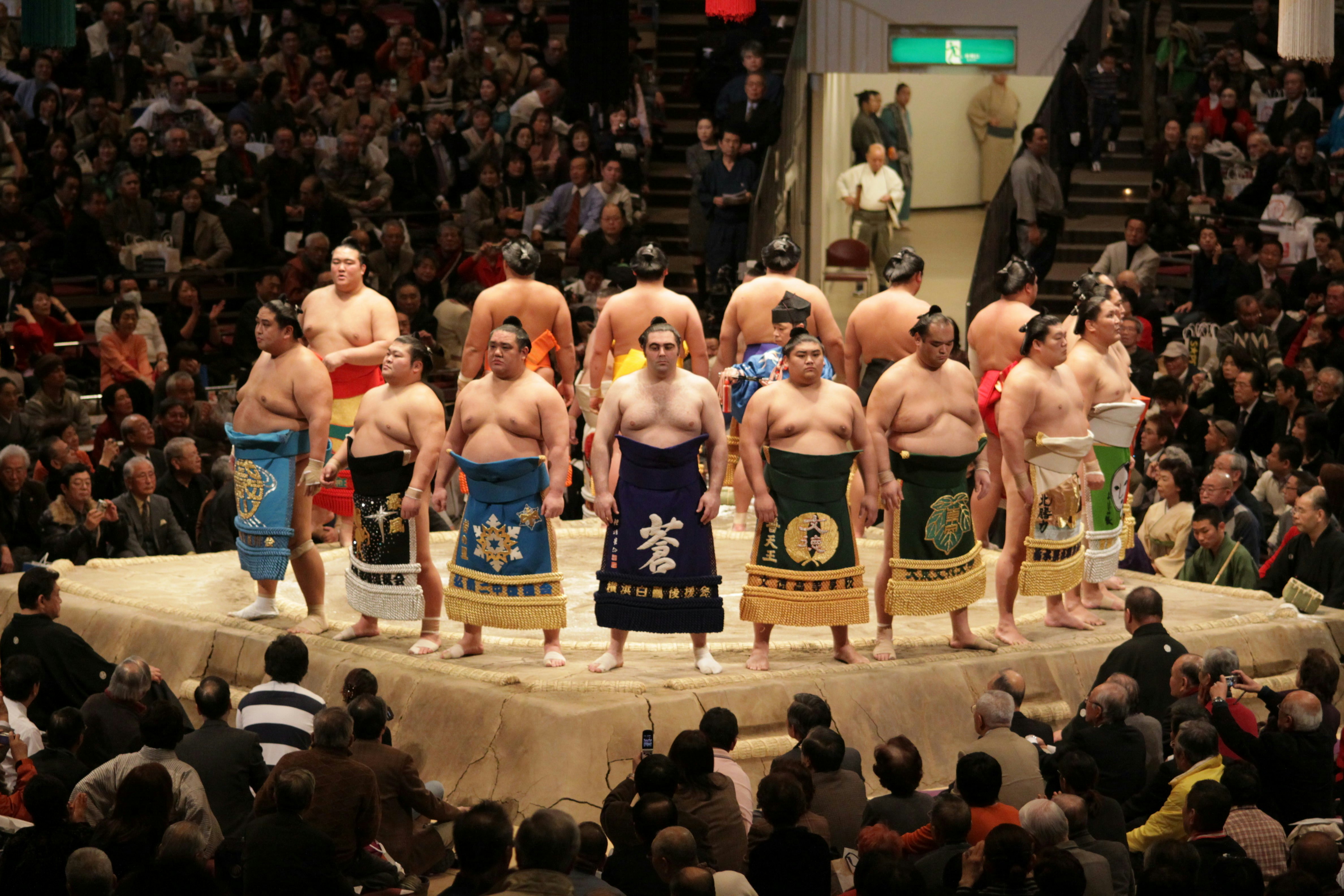 Sumo wrestlers line up for the crowds in the Tokyo Grand Sumo Tournament in Tokyo, Japan.