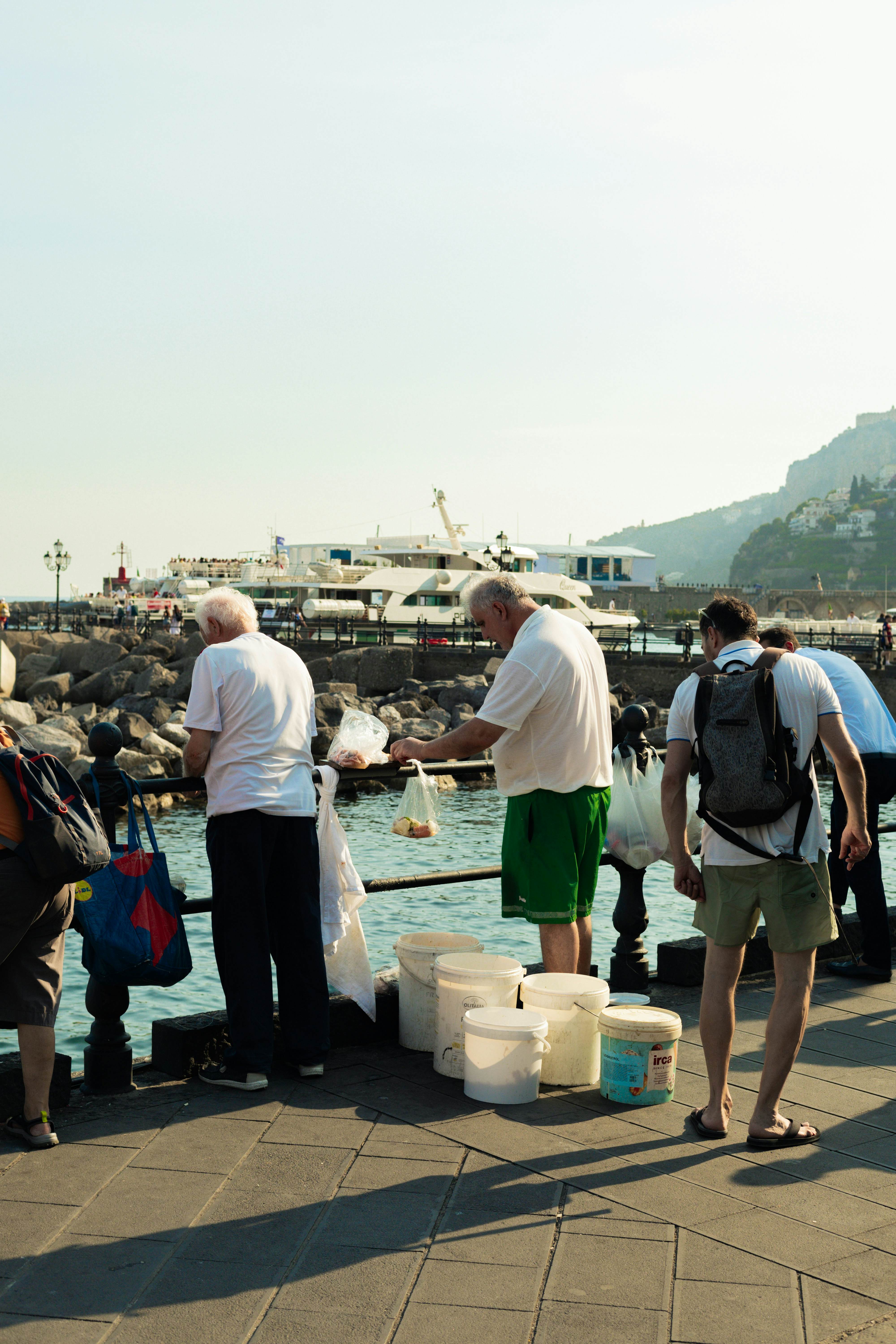 Locals fishing off a pier in Amalfi.