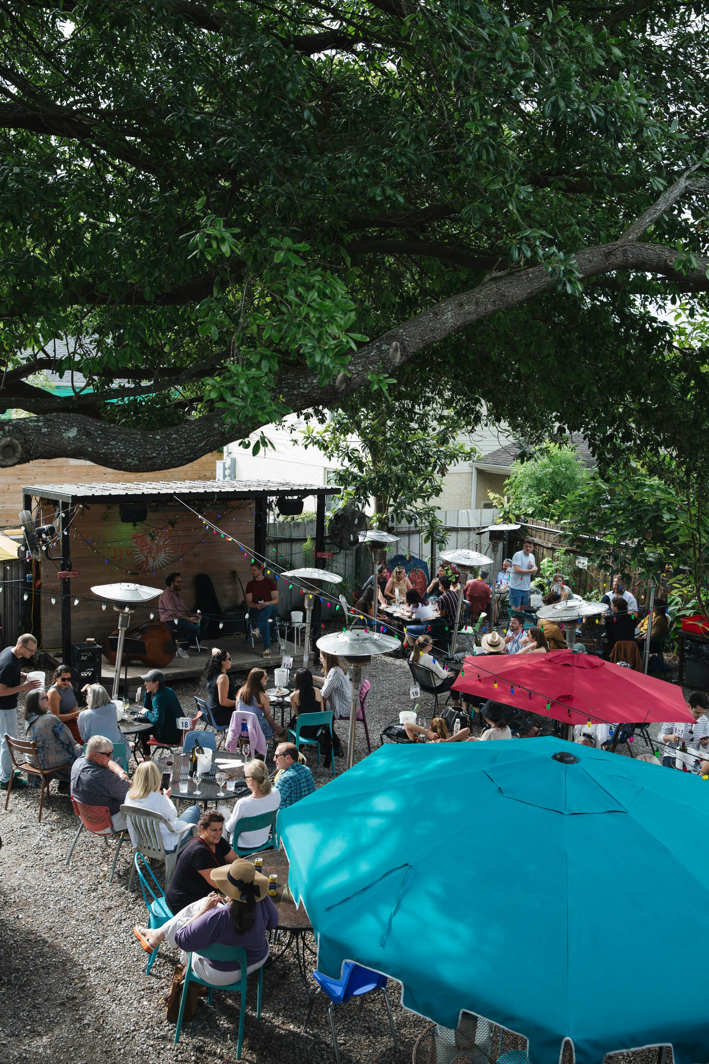 People enjoy live music in Bacchanal's backyard.