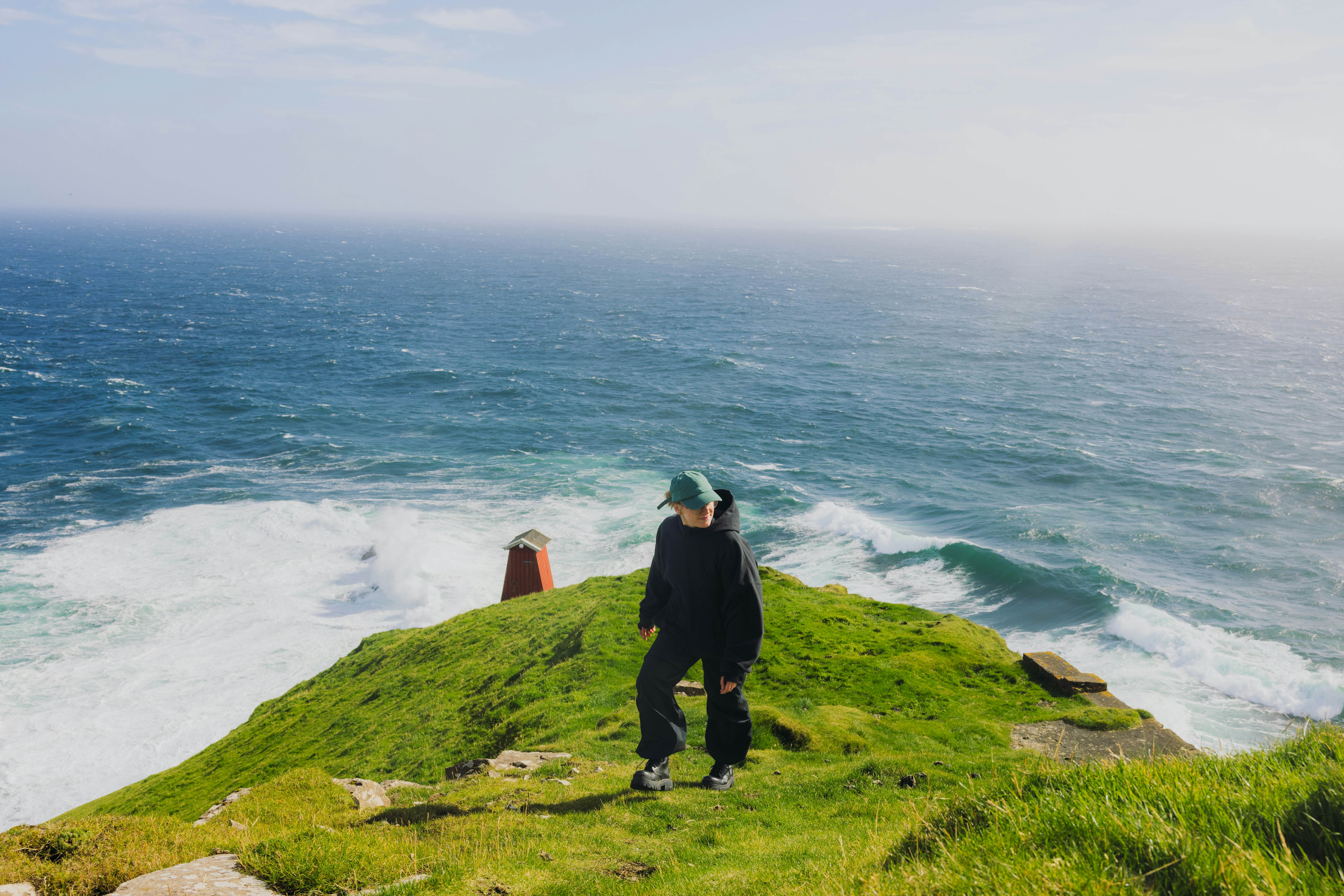 GettyImages-2217673983.jpg
Traveller Hiking with Dramatic Mountain and Ocean Views on Faroe Islands