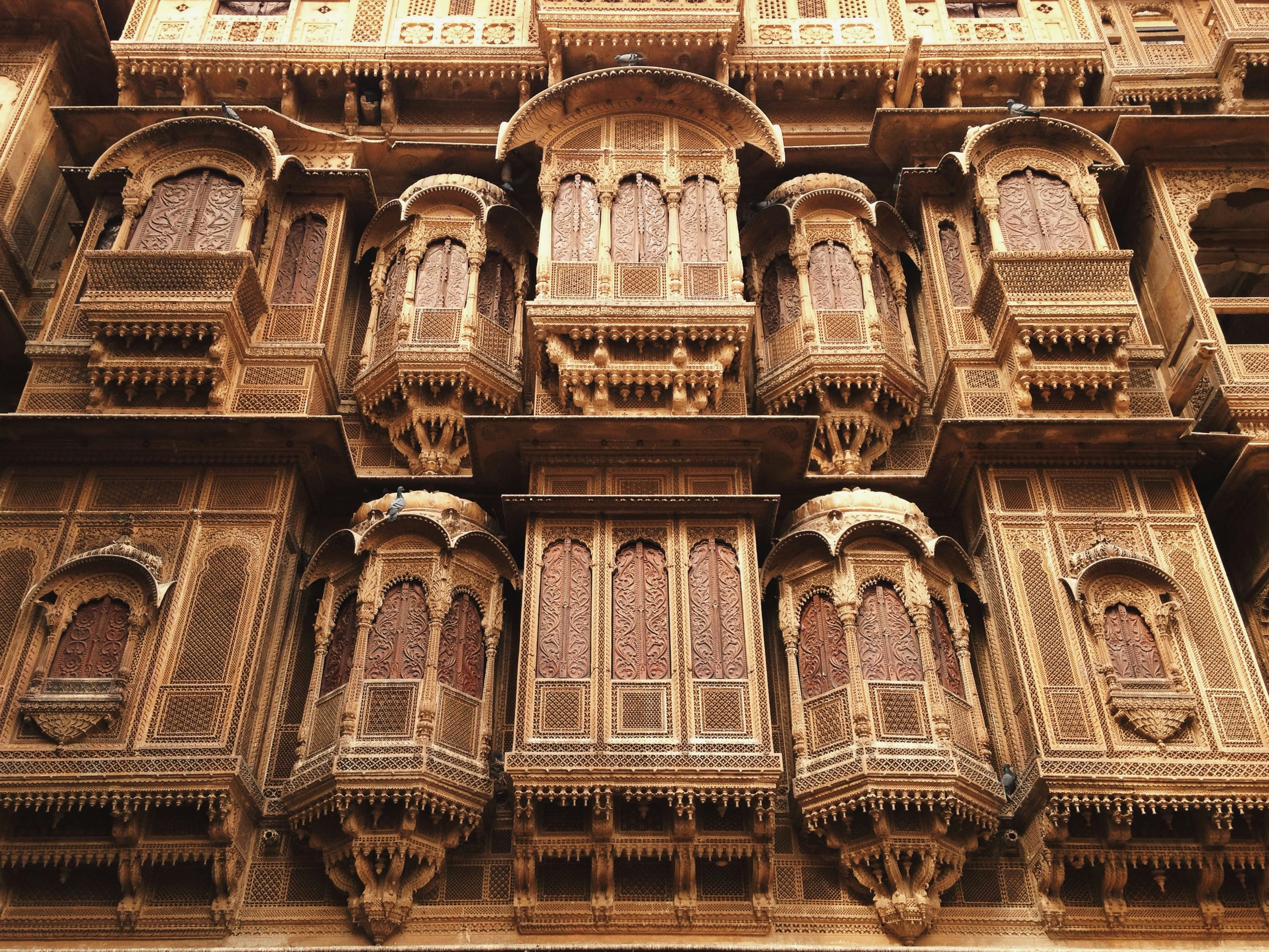 Intricately carved stone windows at the Patwa-ki-Haveli in Jaisalmer, Rajasthan, India.