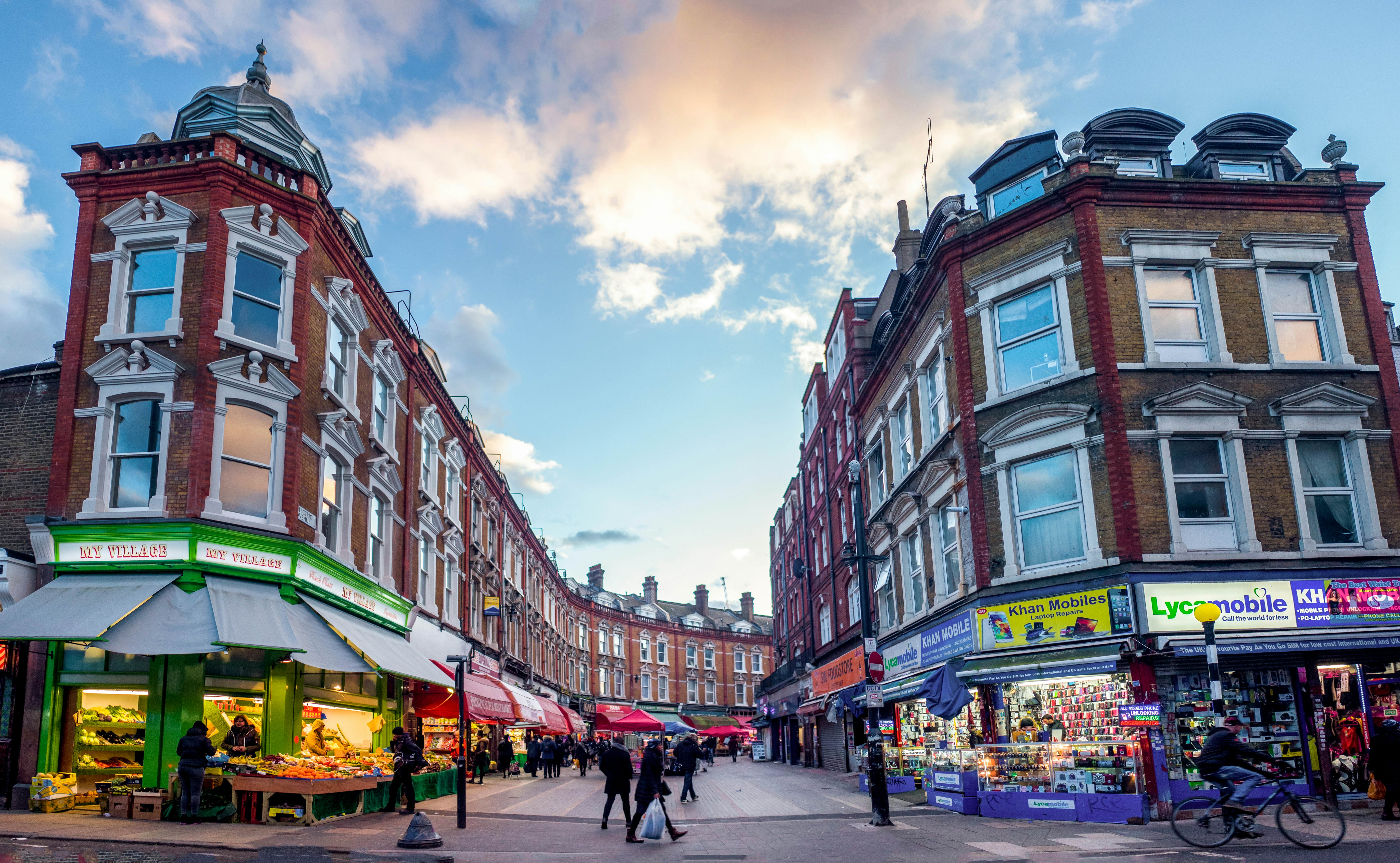 Wide angle view of Brixton's Electric Avenue. A famous London shopping street and home of Brixton Market and interesting food outlets.   License Type: media  Download Time: 2023-11-20T22:08:45.000Z  User: Eointloughney87  Is Editorial: Yes  purchase_order:   