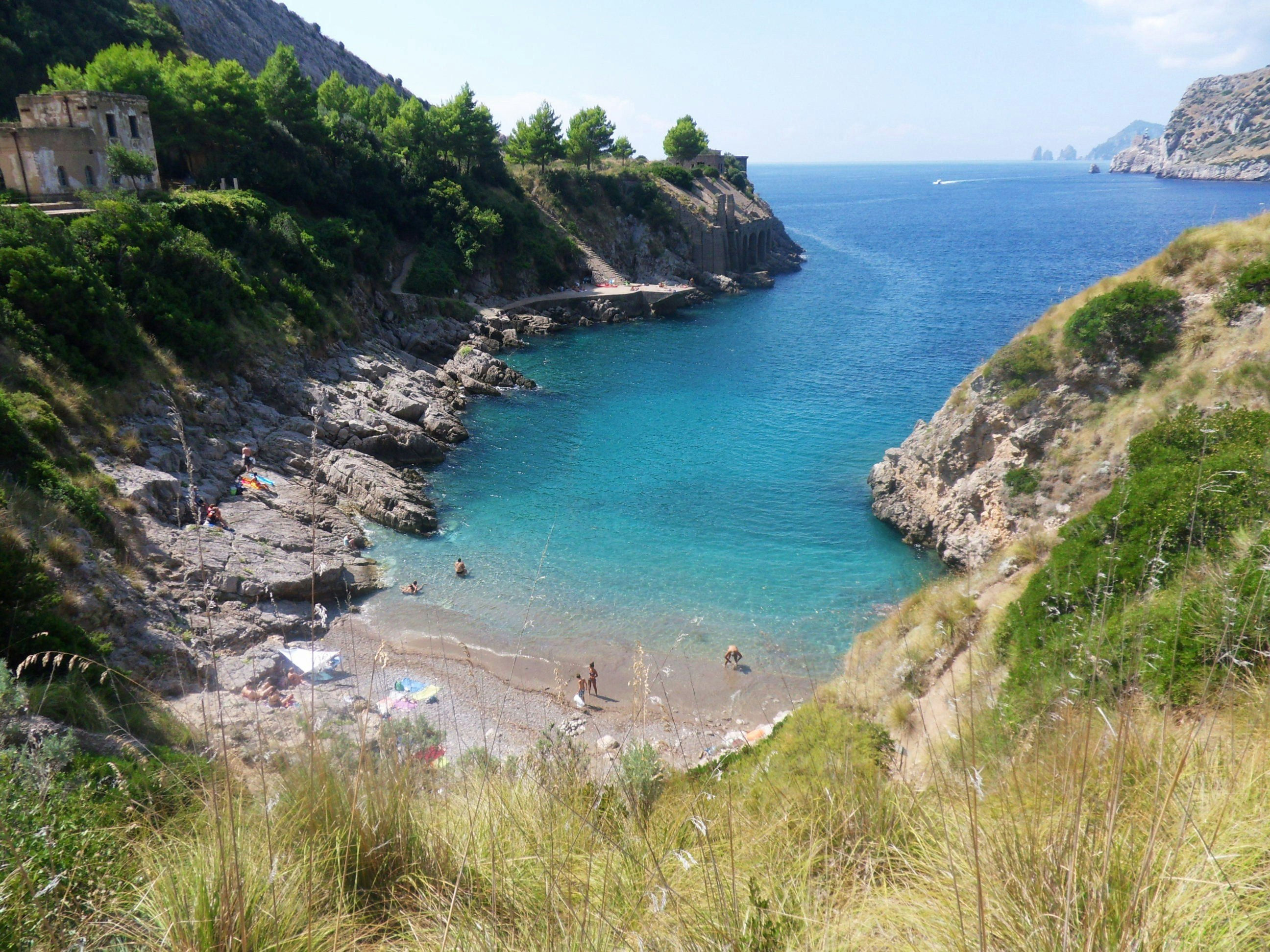 Nerano, Massa Lubrense, Naples, Campania, Italy: Ieranto beach view from the steep path of access, background, the cliffs of Capri