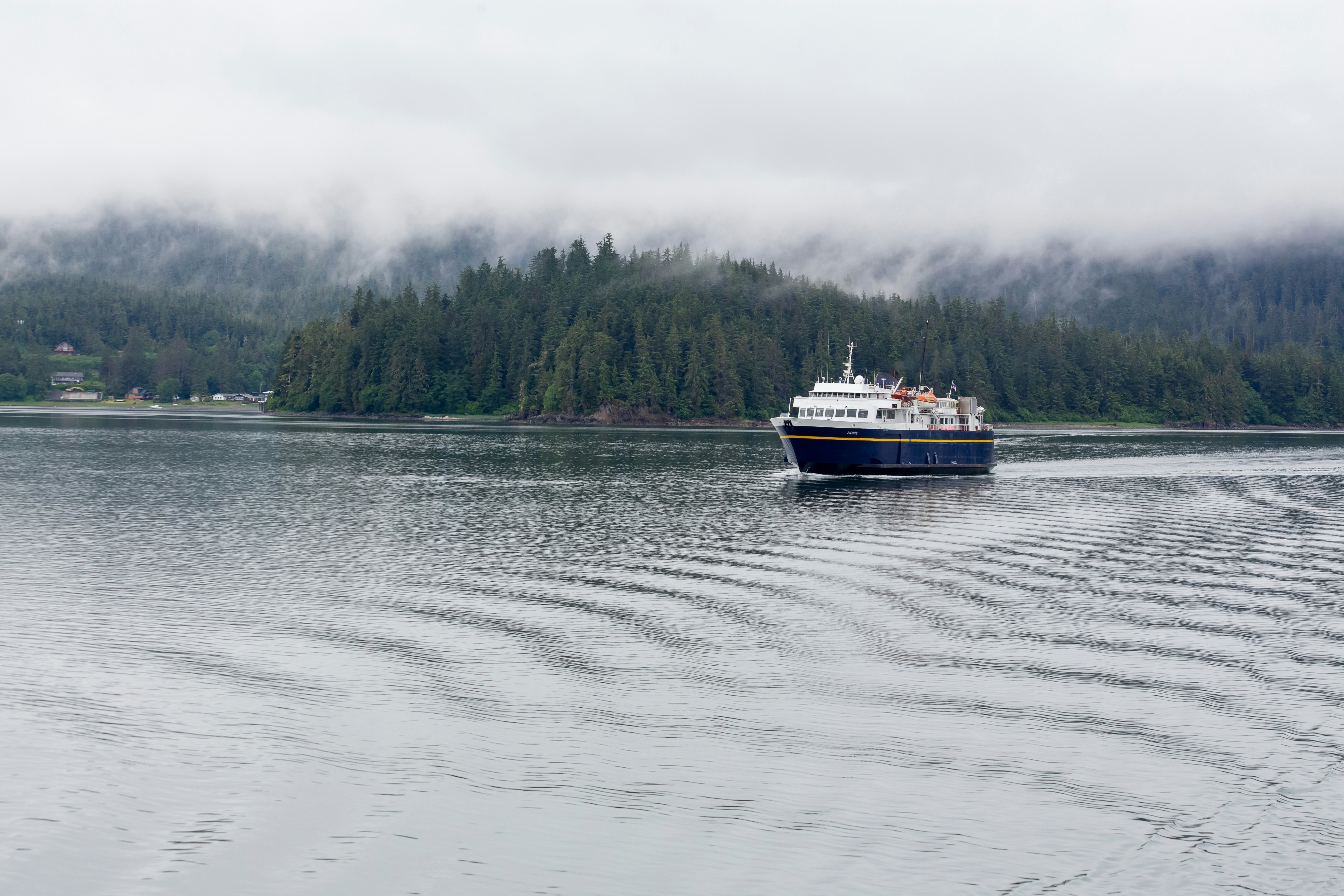 An Alaska Marine Highway System ferry sailing across a harbor.
