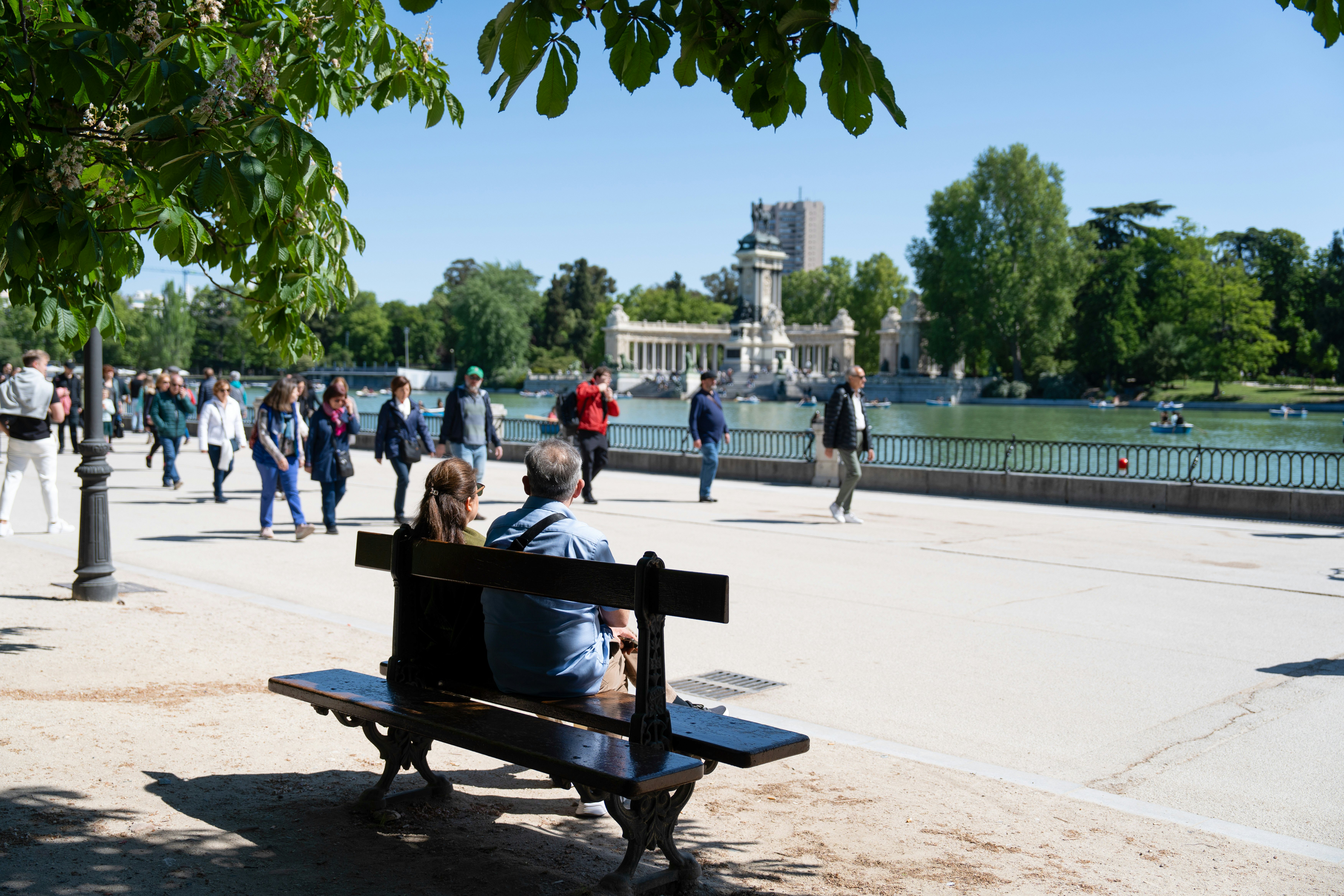 People enjoying the sunshine in Parque del Buen Retiro