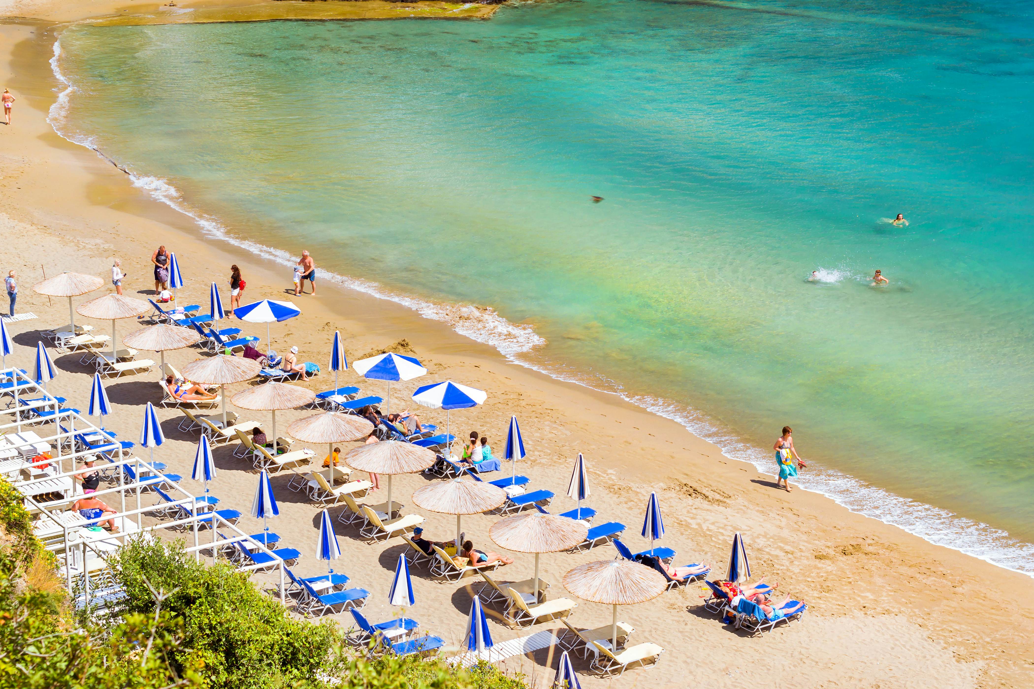 Bali, Greece - May 4, 2016: Sandy beach Varkotopos in sea bay of resort village Bali. Views of shore, washed by waves with sun loungers and parasols where sunbathing and swim tourists. Crete, Greece, License Type: media, Download Time: 2024-11-29T08:58:49.000Z, User: pinkjozie64, Editorial: true, purchase_order: 56530 - Guidebooks, job: Global Publishing WIP, client: CRETE 9, other: JO-ANNE RIDDELL