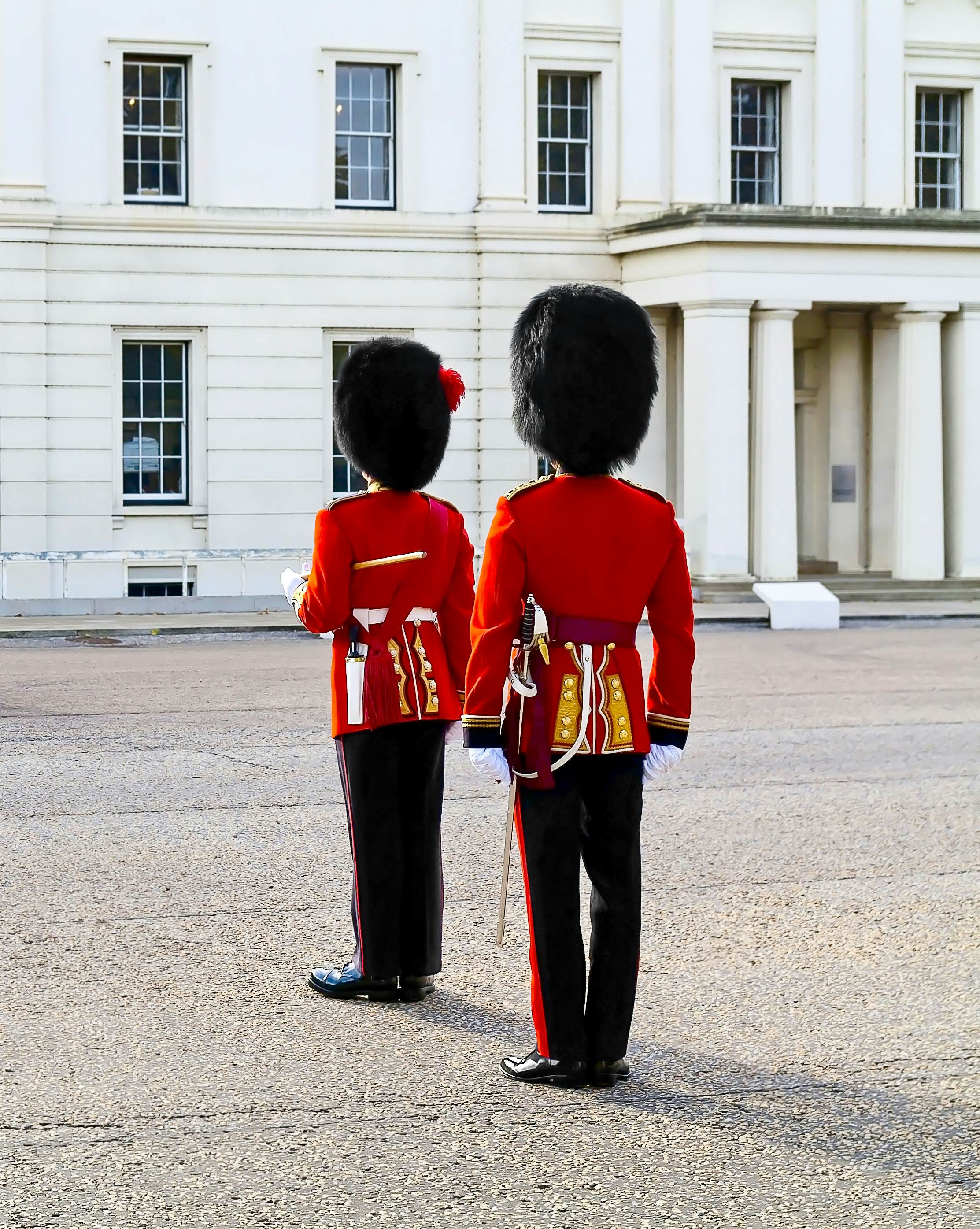 Two guards in red coat