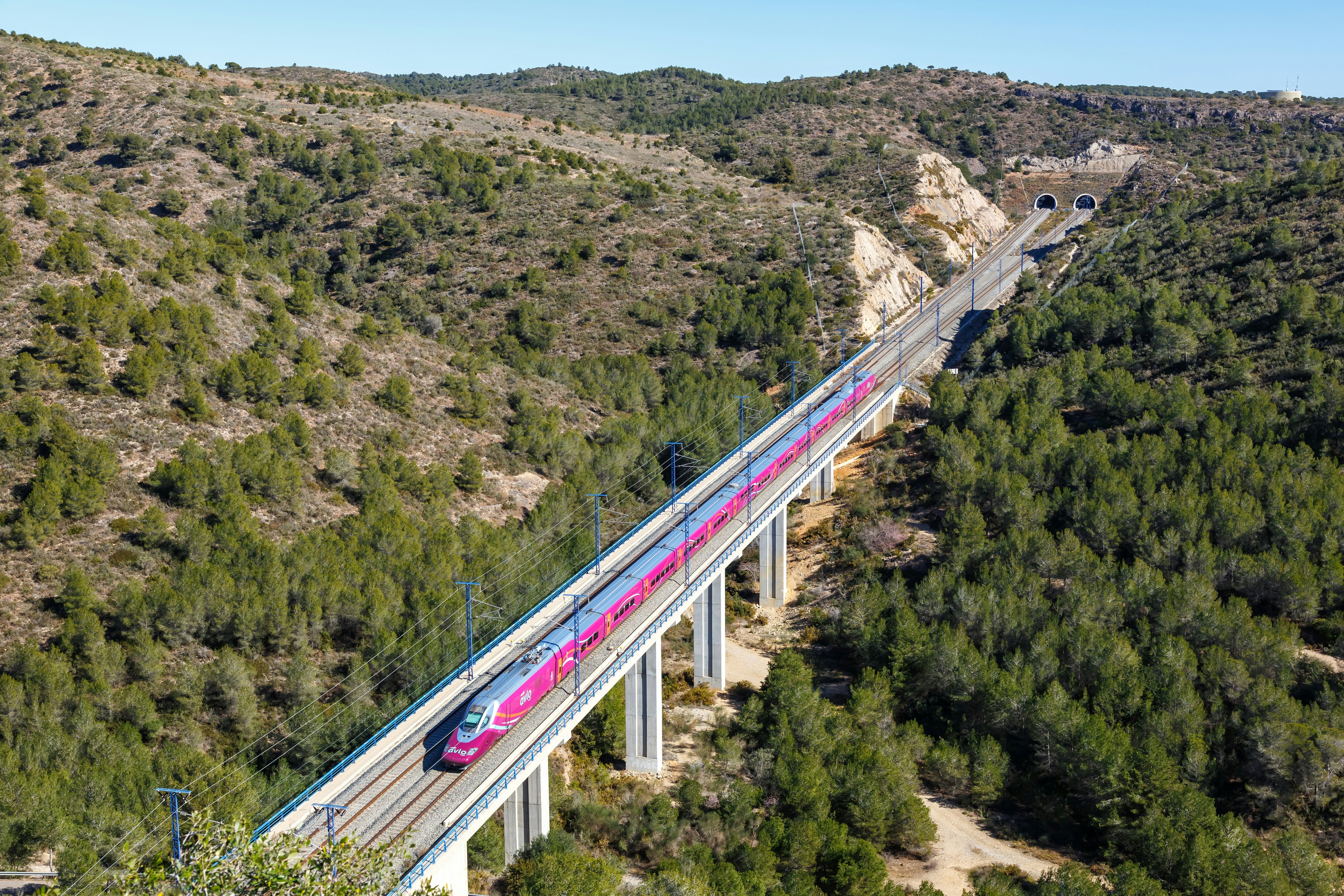 Roda de Bera, Spain - February 20, 2022: Talgo 350 high-speed train of RENFE AVLO on the Madrid - Barcelona high speed rail railway line near Roda de Bera in Spain.