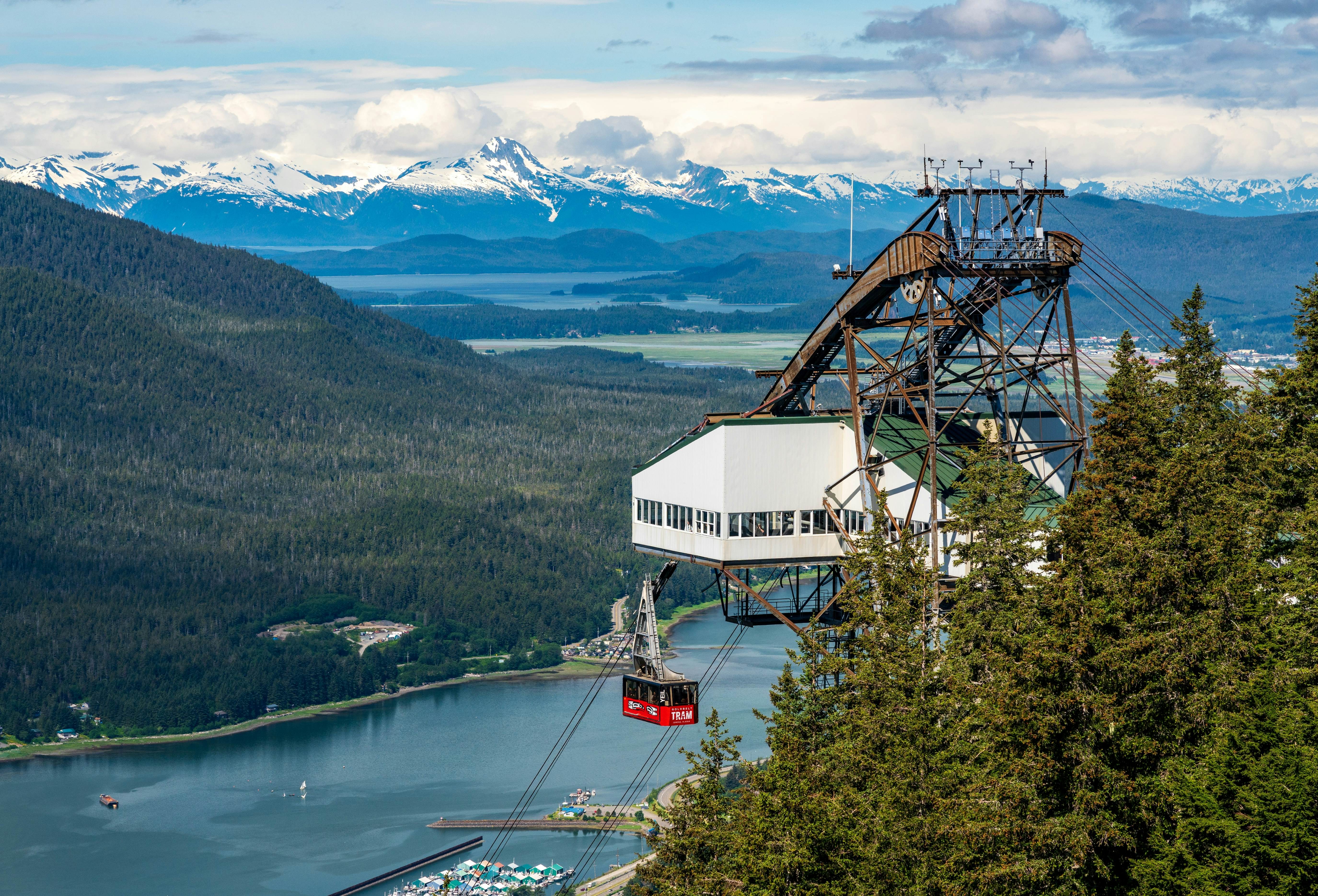 Juneau, AK - 9 June 2022: Passengers arriving at the mountain in the red cable car car of Goldbelt tram, License Type: media, Download Time: 2025-12-03T19:48:07.000Z, User: mvm_lonelyplanet, Editorial: true, purchase_order: 56530 - Guidebooks, job: Alaska 15, client:  Global Publishing-WIP, other: Virginia Moreno