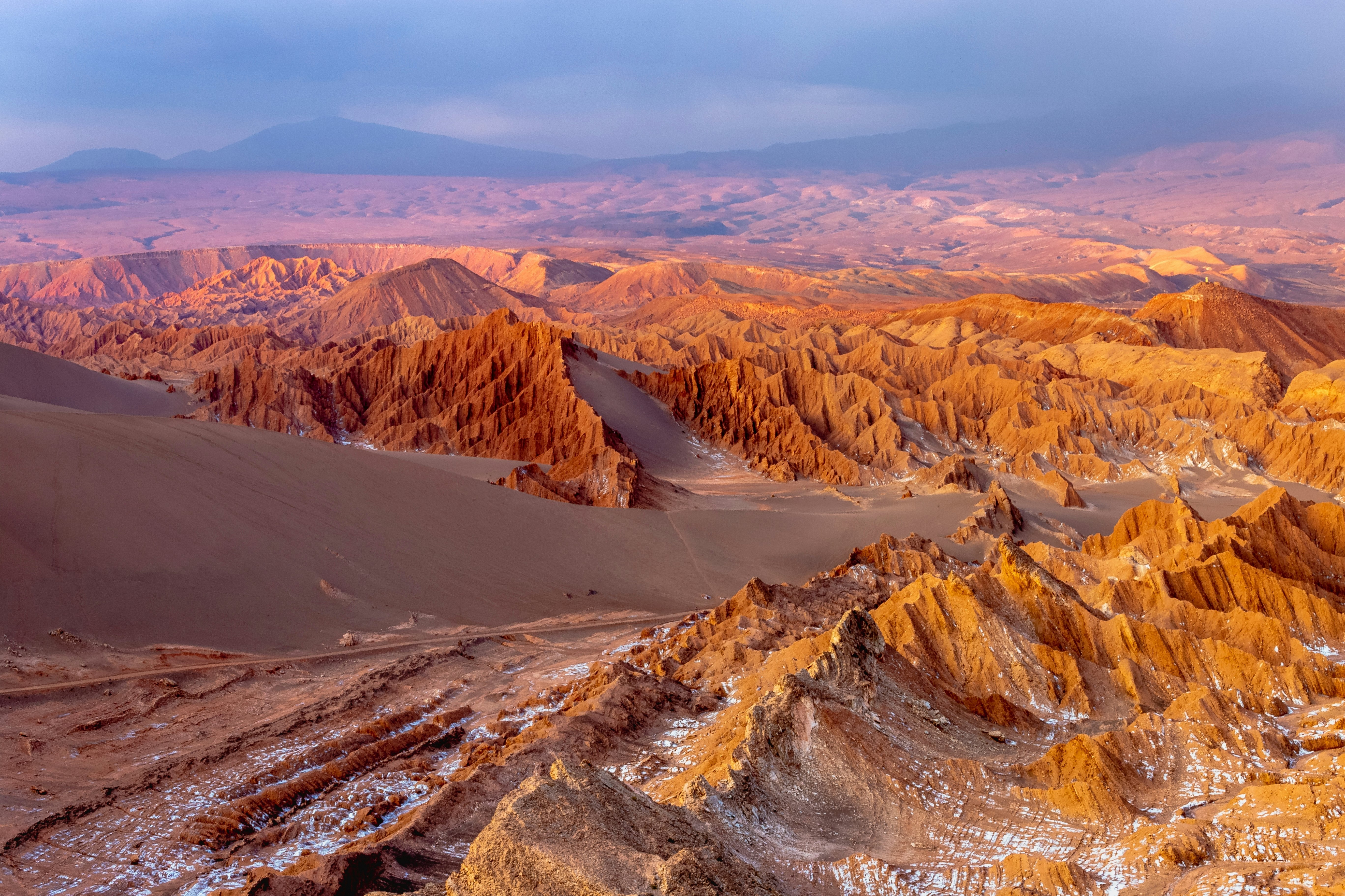 A sunset view of a cold desert landscape in Valle de la Luna in the Atacama desert, Chile.