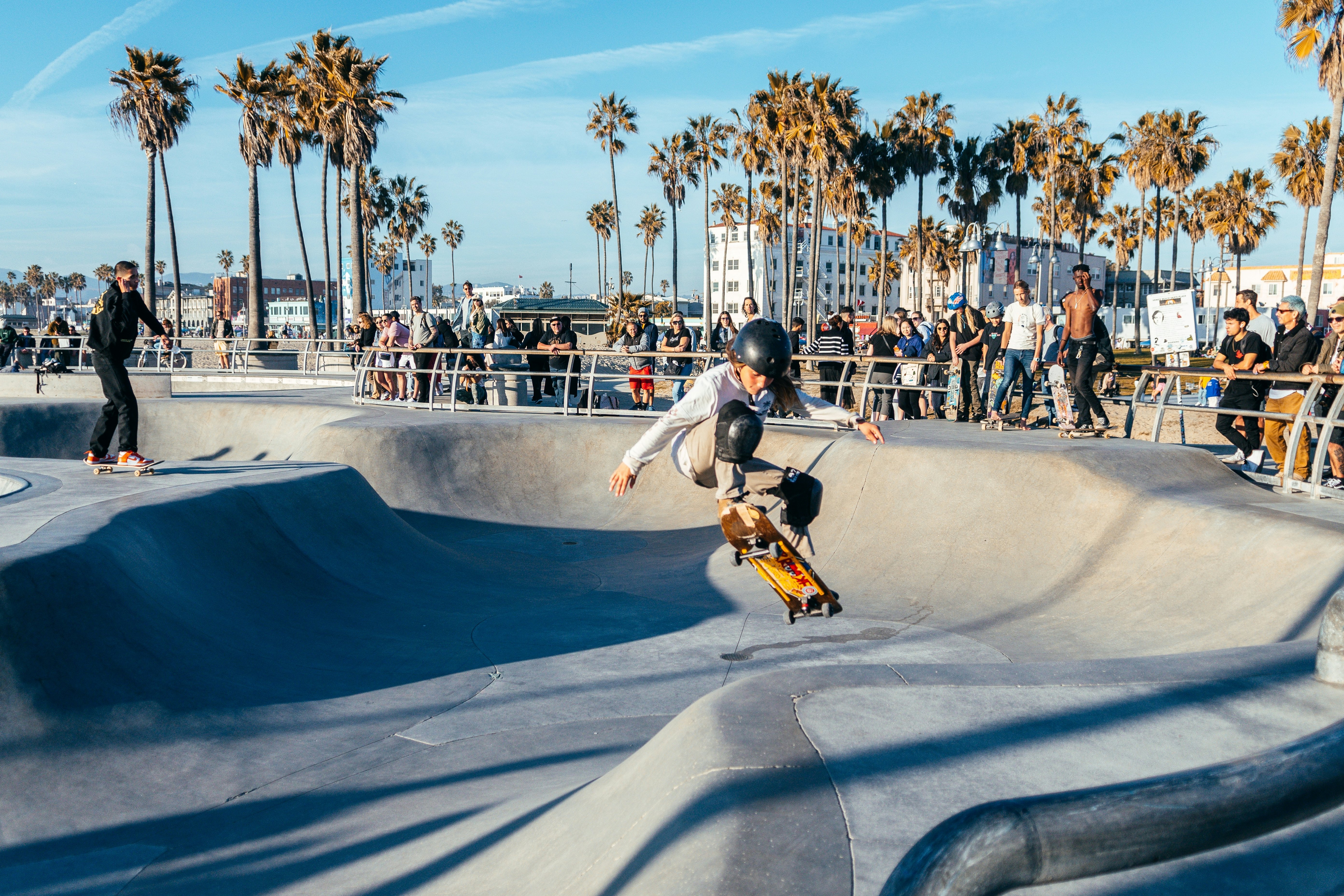 people is skating at venice beach skatepark, los angeles.