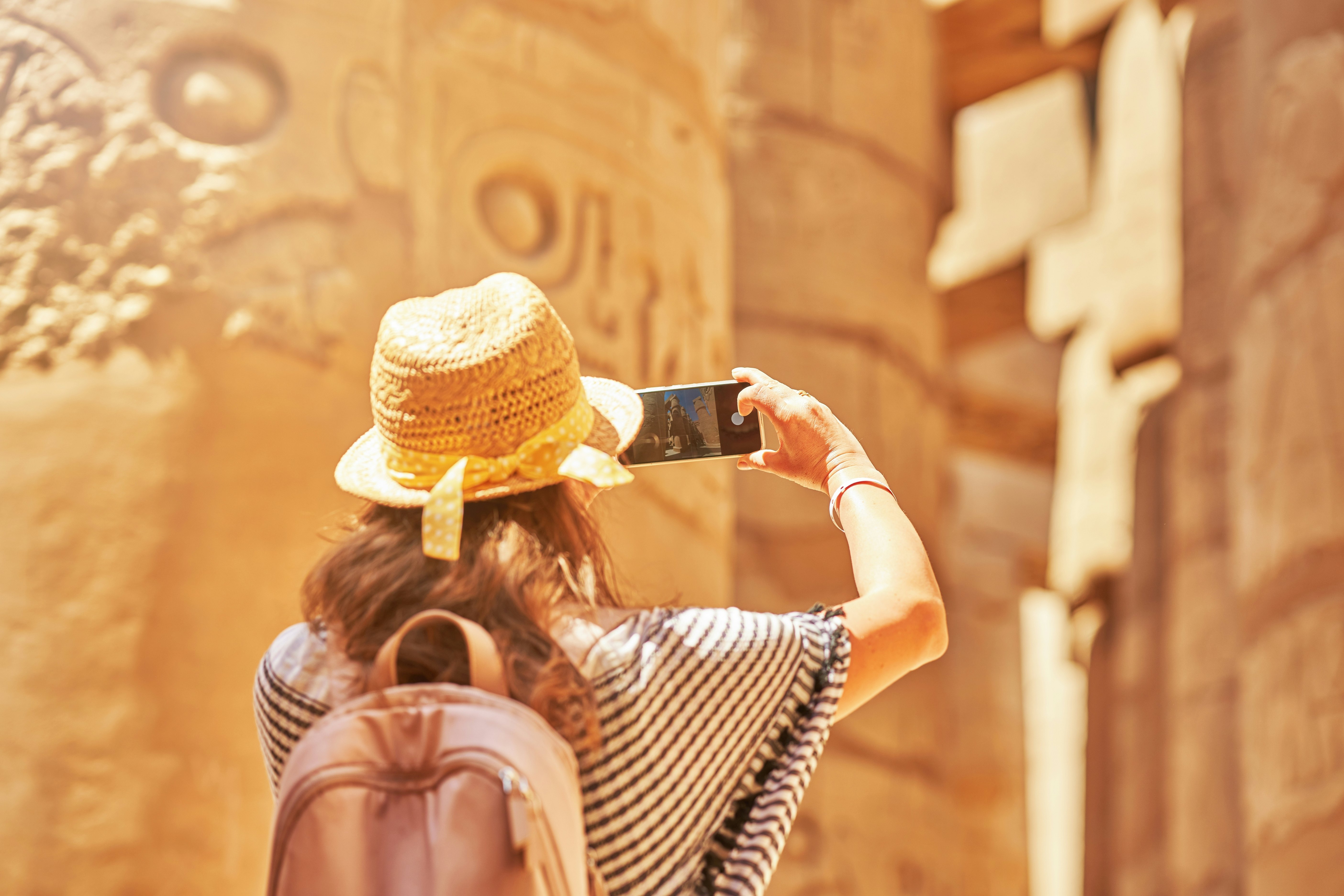 Tourist woman in Karnak Temple in Luxor Egypt