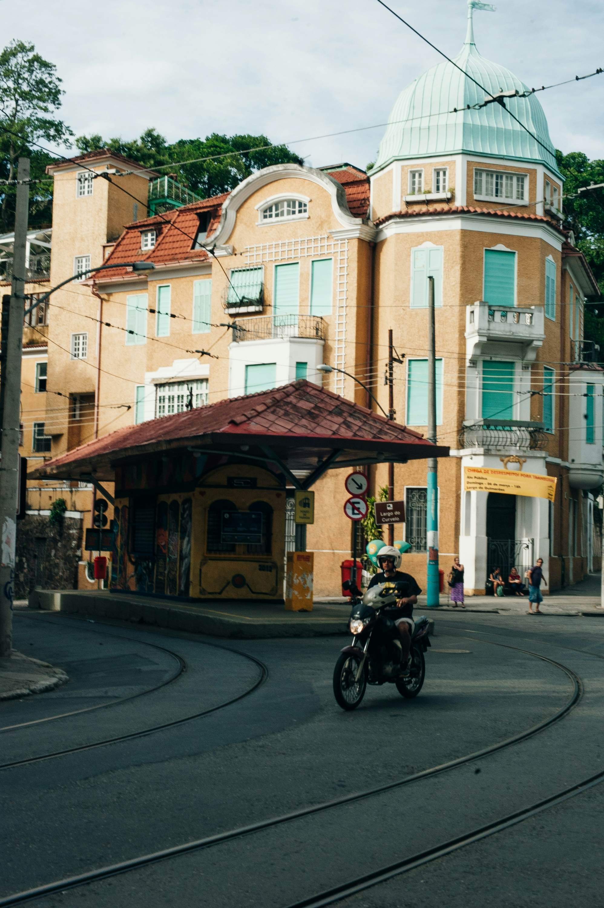A motorcyclist on a city street.