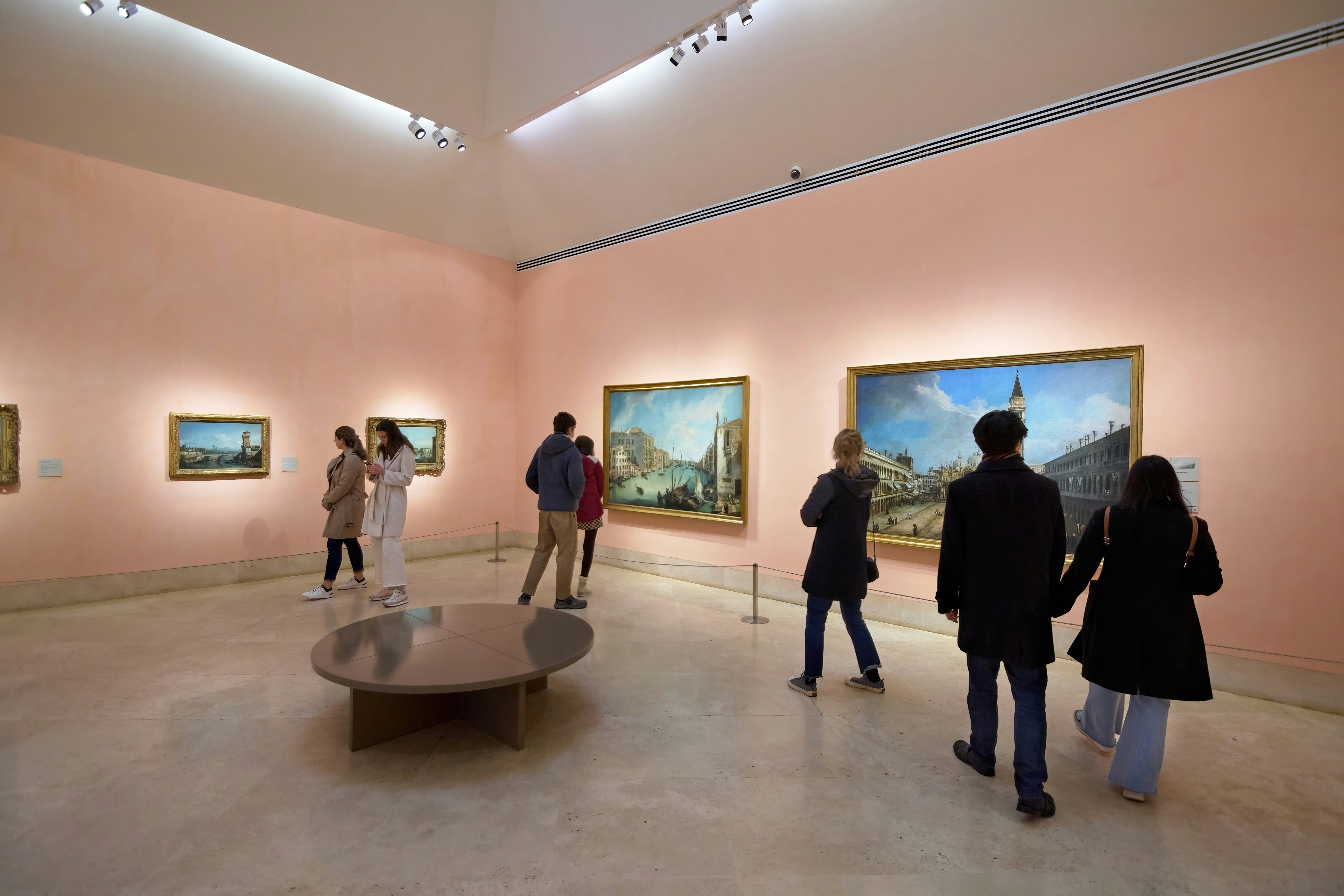 Small group of people in one of the rooms of the Thyssen Bornemisza national museum in Madrid, Spain