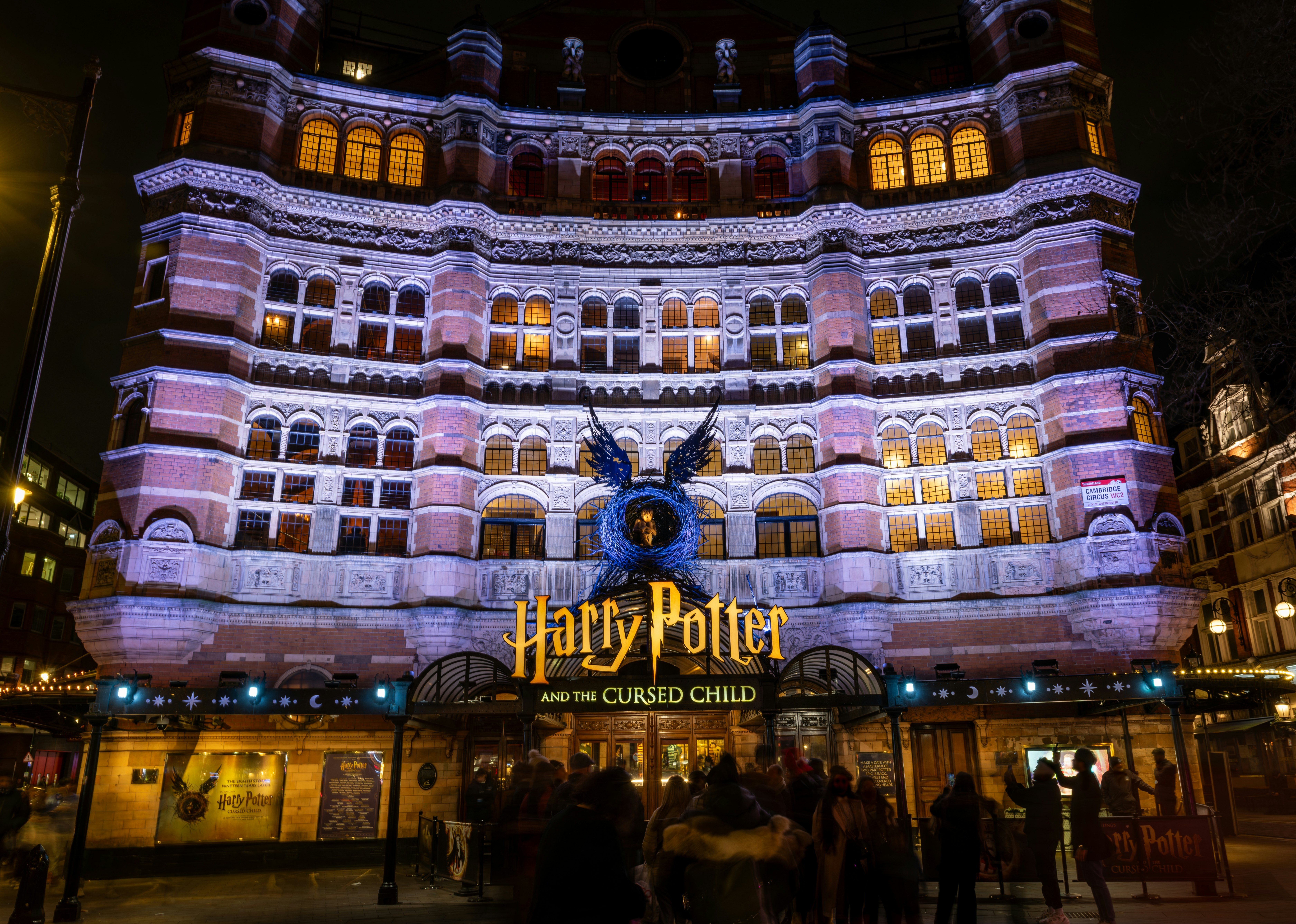 London. UK: A night time view of the facade of the Palace Theatre hosting the show Harry Potter and the Curse Child.