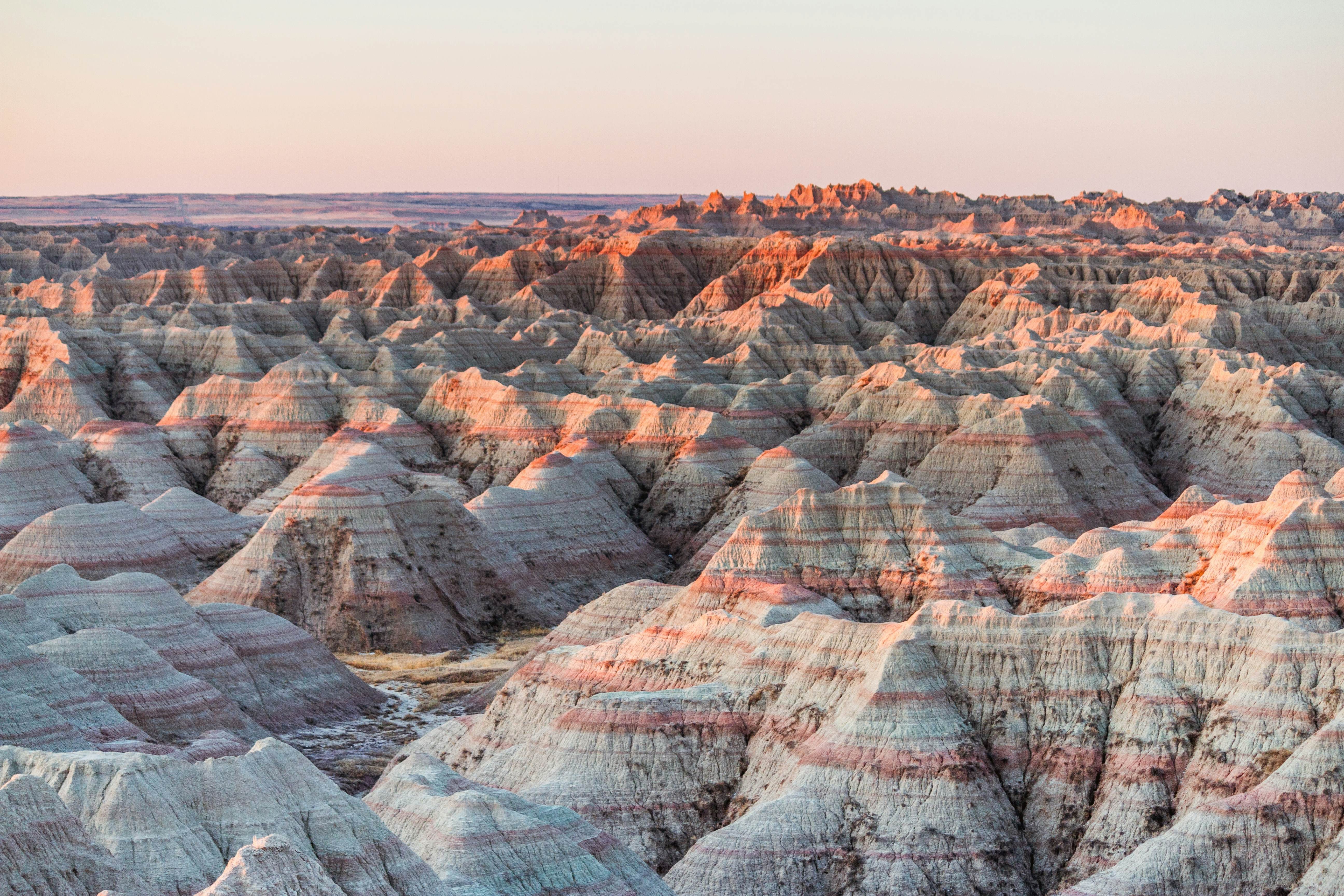 The beautiful Badlands National Park in South Dakota with sunset view in the background, License Type: media, Download Time: 2025-09-11T16:14:30.000Z, User: Eointloughney87, Editorial: false, purchase_order: 56530 - Guidebooks, job: Global Publishing-WIP, client: Midwest USA 1, other: Eoin T Loughney