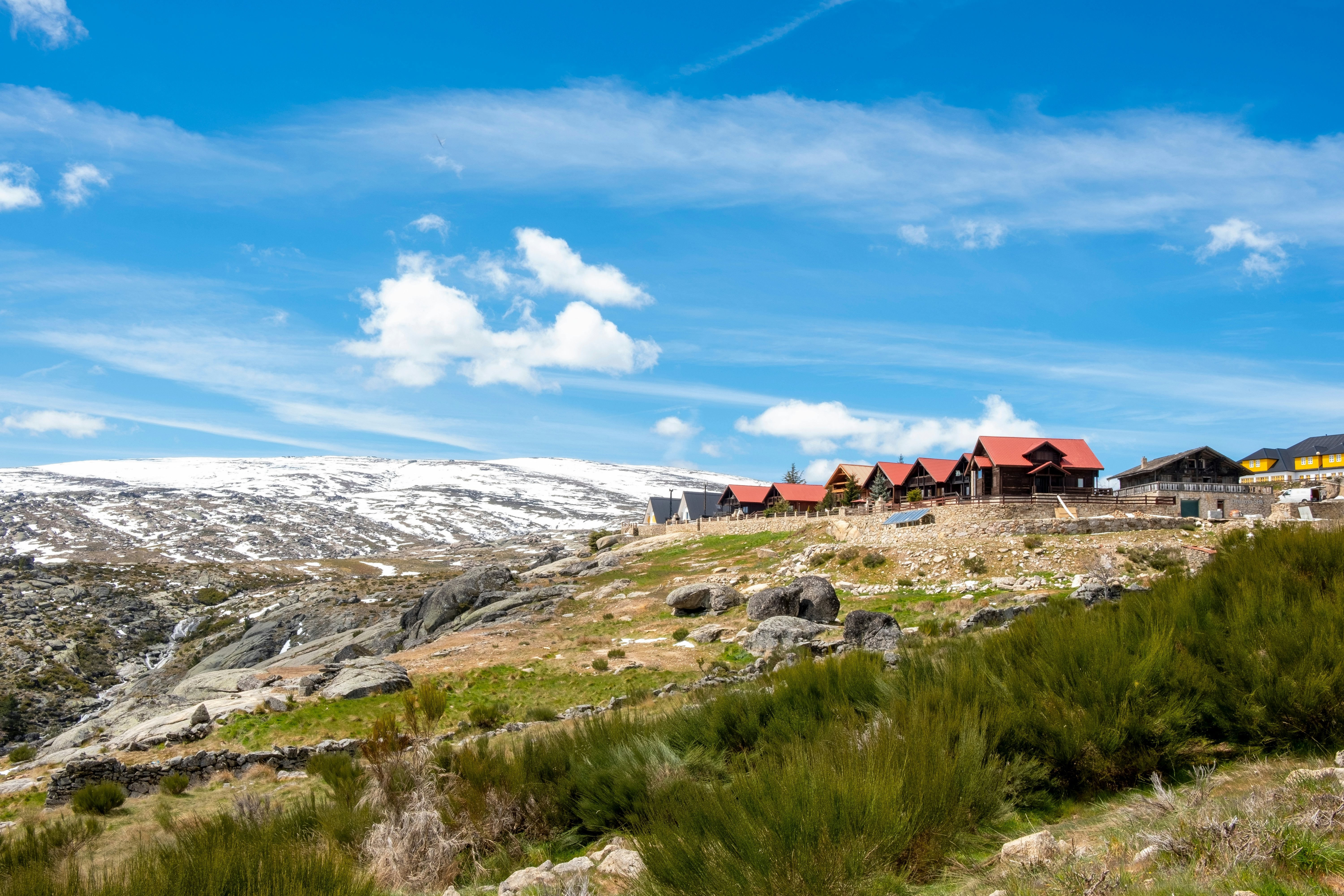 A mountain town surrounded by snow-covered hills.