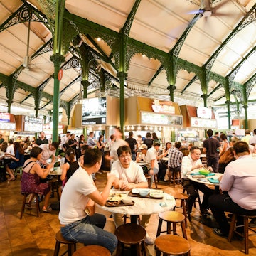 Singapore- July 11, 2024: View of people dining in the Lau Pa Sat hawker market in Singapore, it was one of the oldest Victorian structures in Southeast Asia., License Type: media, Download Time: 2025-05-29T14:37:34.000Z, User: lonelyplanetmedia, Editorial: true, purchase_order: 65050 - Digital Destinations and Articles, job: Global Publishing WIP, client: Global Publishing WIP, other: Peterson Haggarty // SS Comp Ingestion