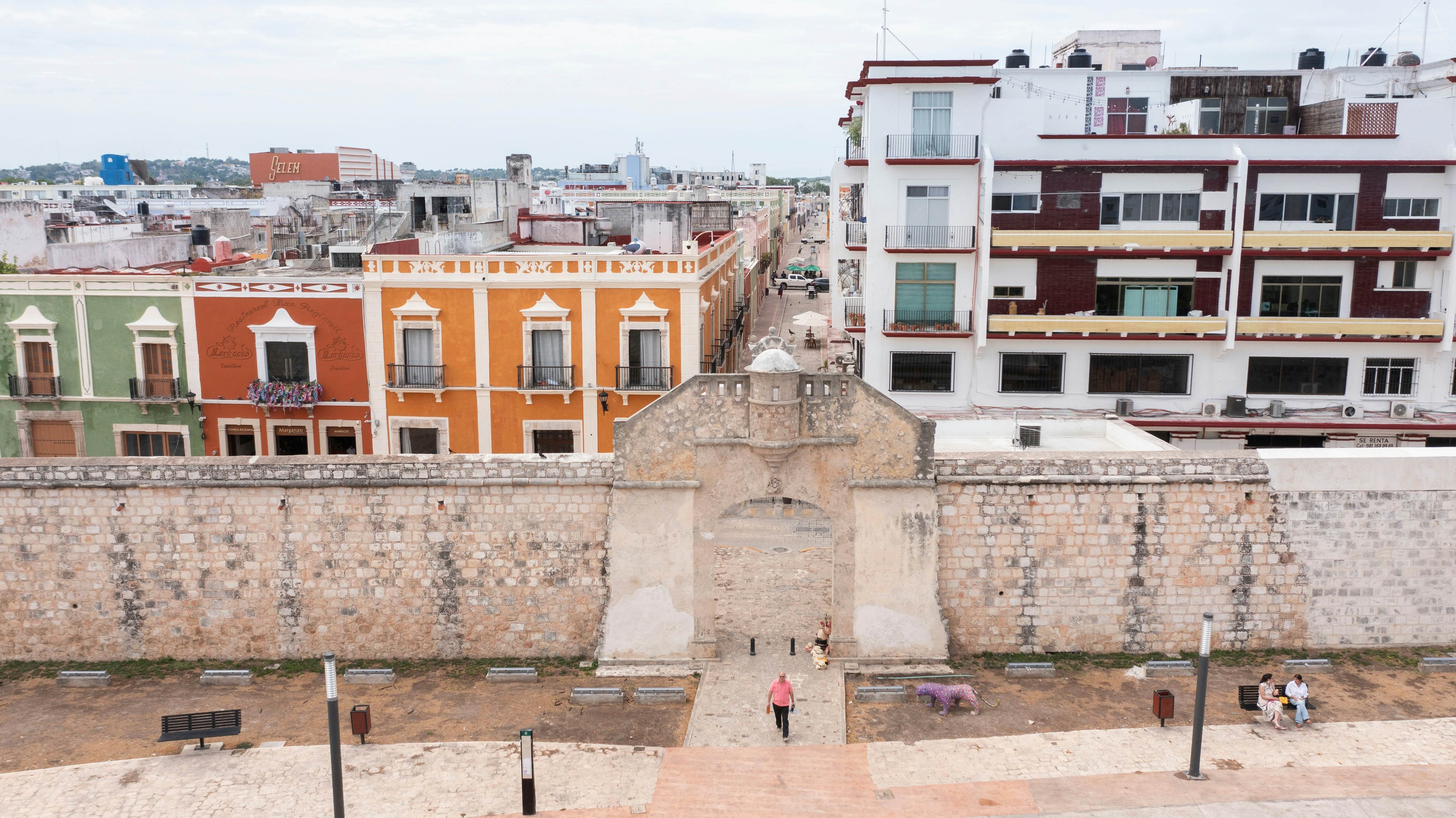 Campeche, Campeche, Mexico - June 14, 2024: People walk through the historic gate of the colonial walls of the central district., License Type: media, Download Time: 2026-02-24T15:39:39.000Z, User: clairenaylor, Editorial: true, purchase_order: 65050 - Digital Destinations and Articles, job: Online editorial, client: Historic sites Mexico, other: Claire Naylor