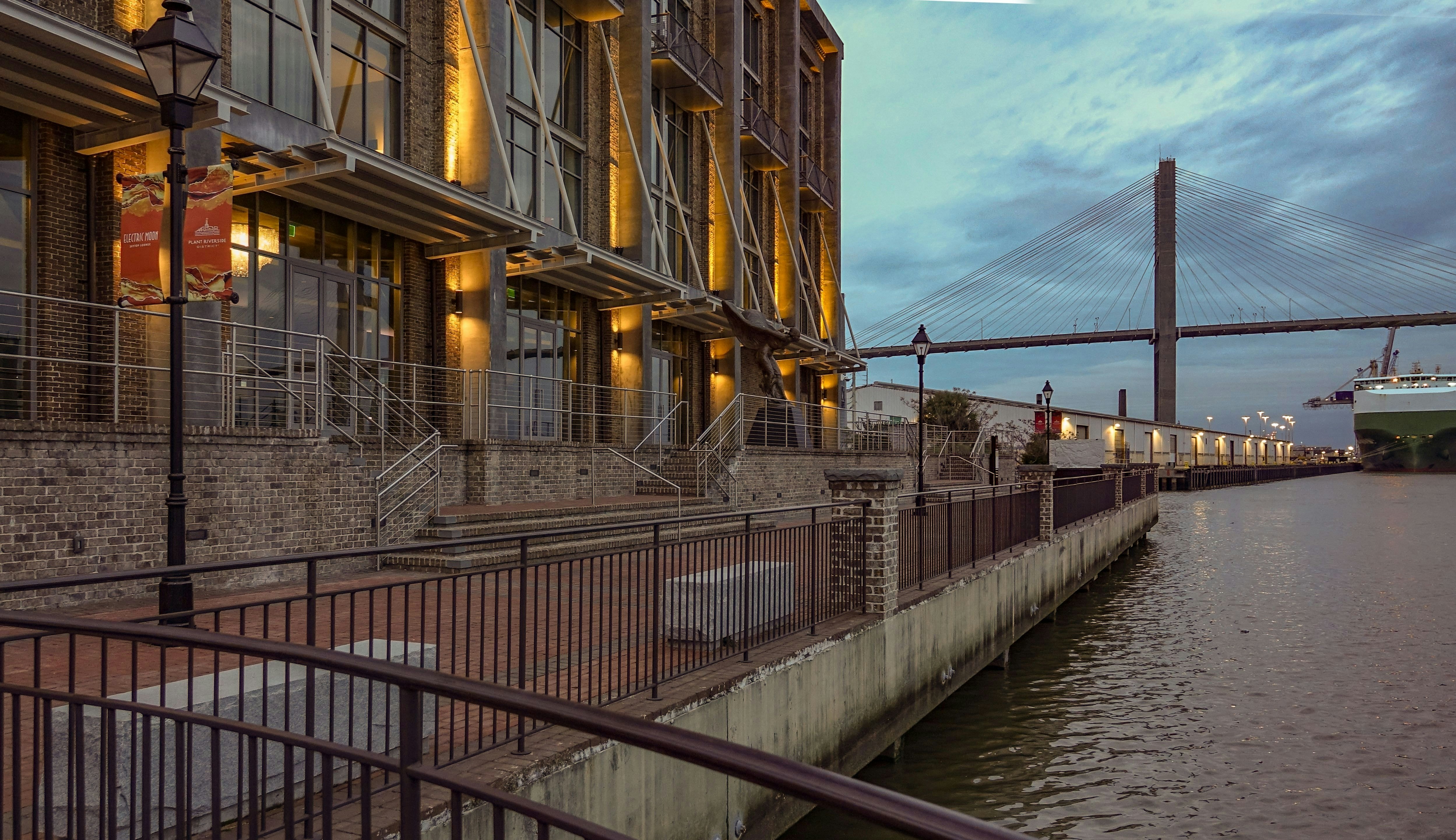 A dusk view of the Plant Riverside District by the Savannah River in Savannah, Georgia, USA.