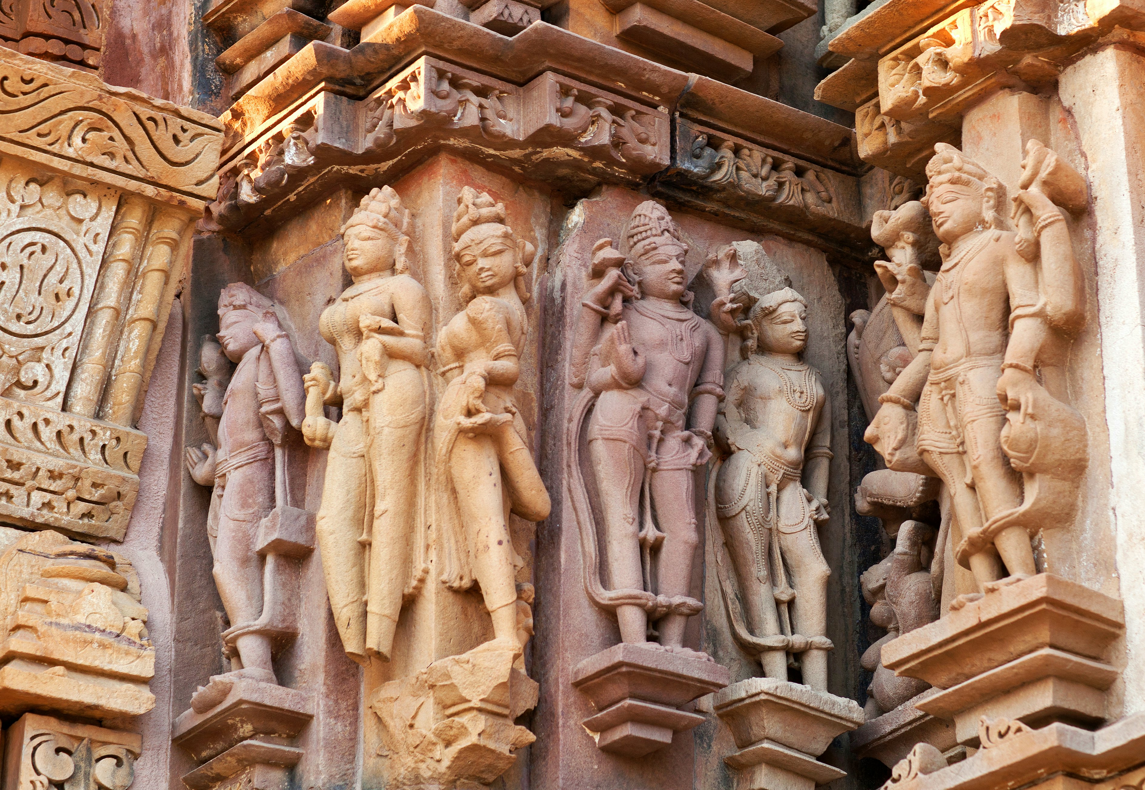 Ancient reliefs at famous erotic temple in Khajuraho, India. Most Khajuraho temples were built between 950 and 1050 by the Chandela dynasty.; Top temples in India; other:Tasmin Waby