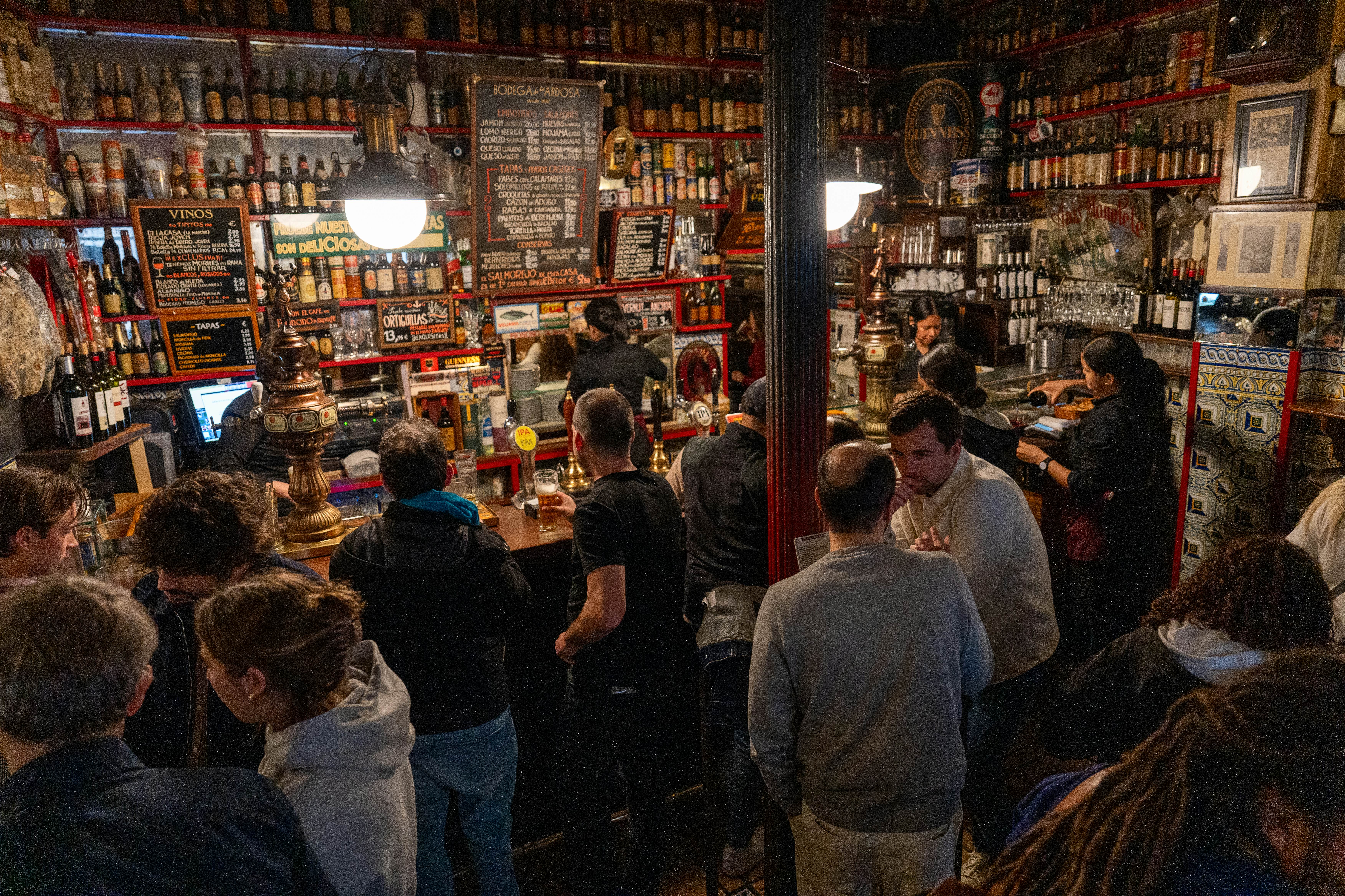 APRIL 30, 2024: Facundo Yair and his girlfriend, Carlota Urdiales, ordering tapas and beer at Bodega de La Ardosa. 

Spain Marketing 1379722