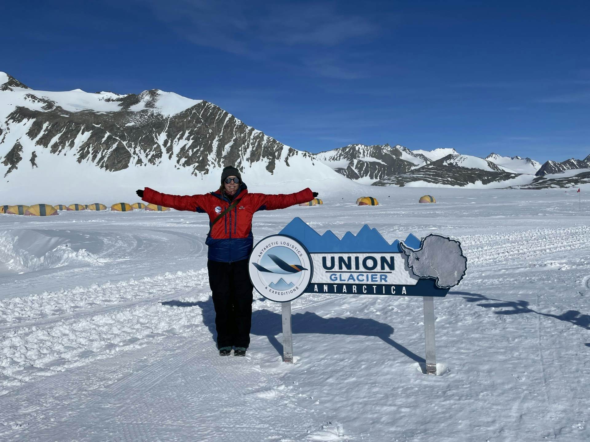 A large truck with wheels adapted for snowy terrain.