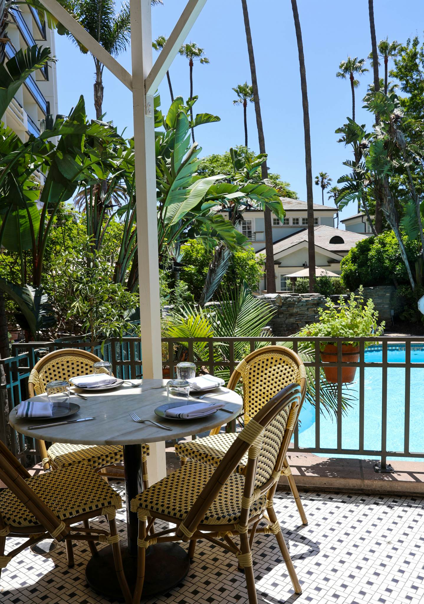 A table next to a pool. 