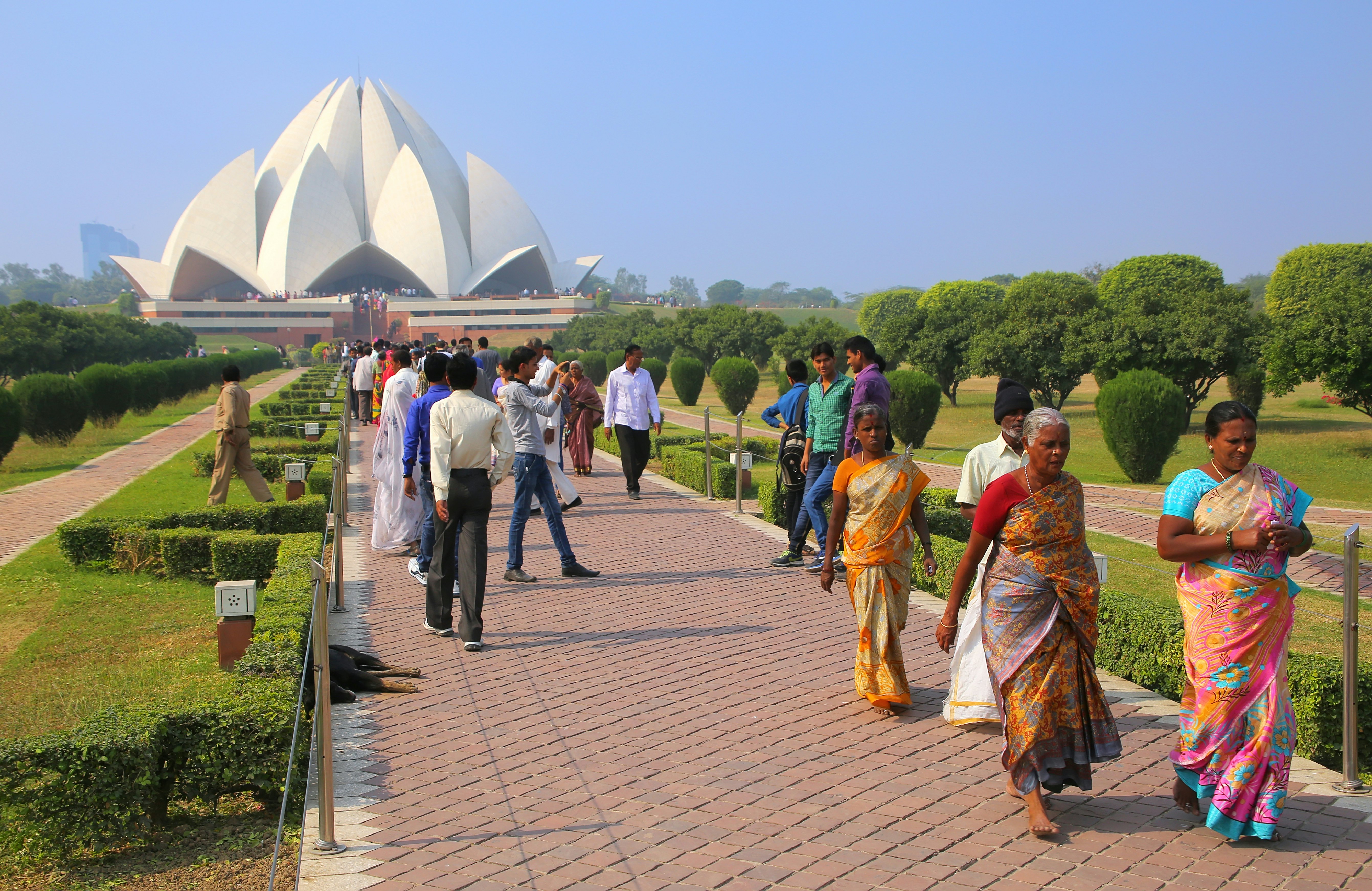 Visitors in the garden at the Bahai House of Worship, Delhi, India.