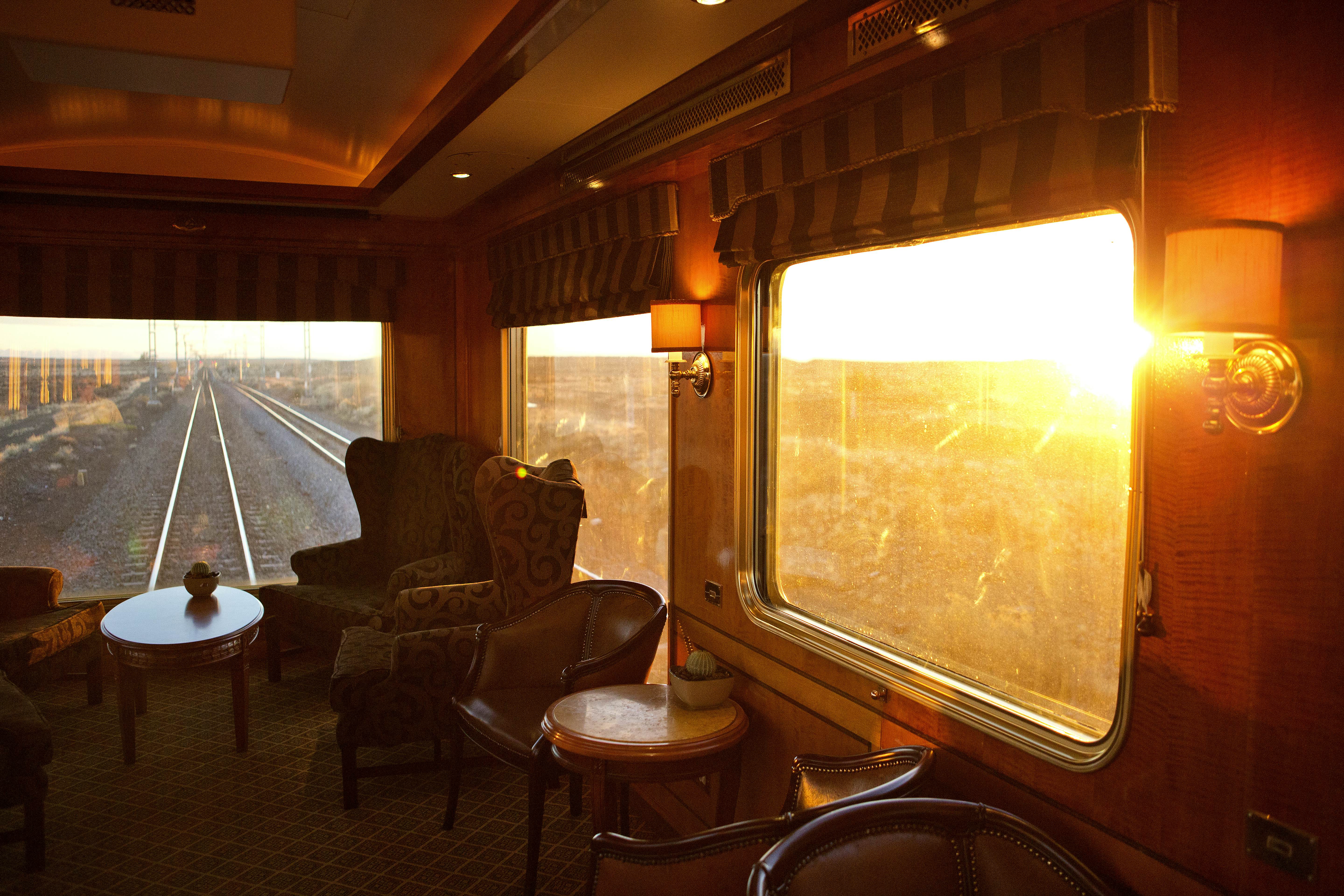 Sunlight streams through the window on a train.