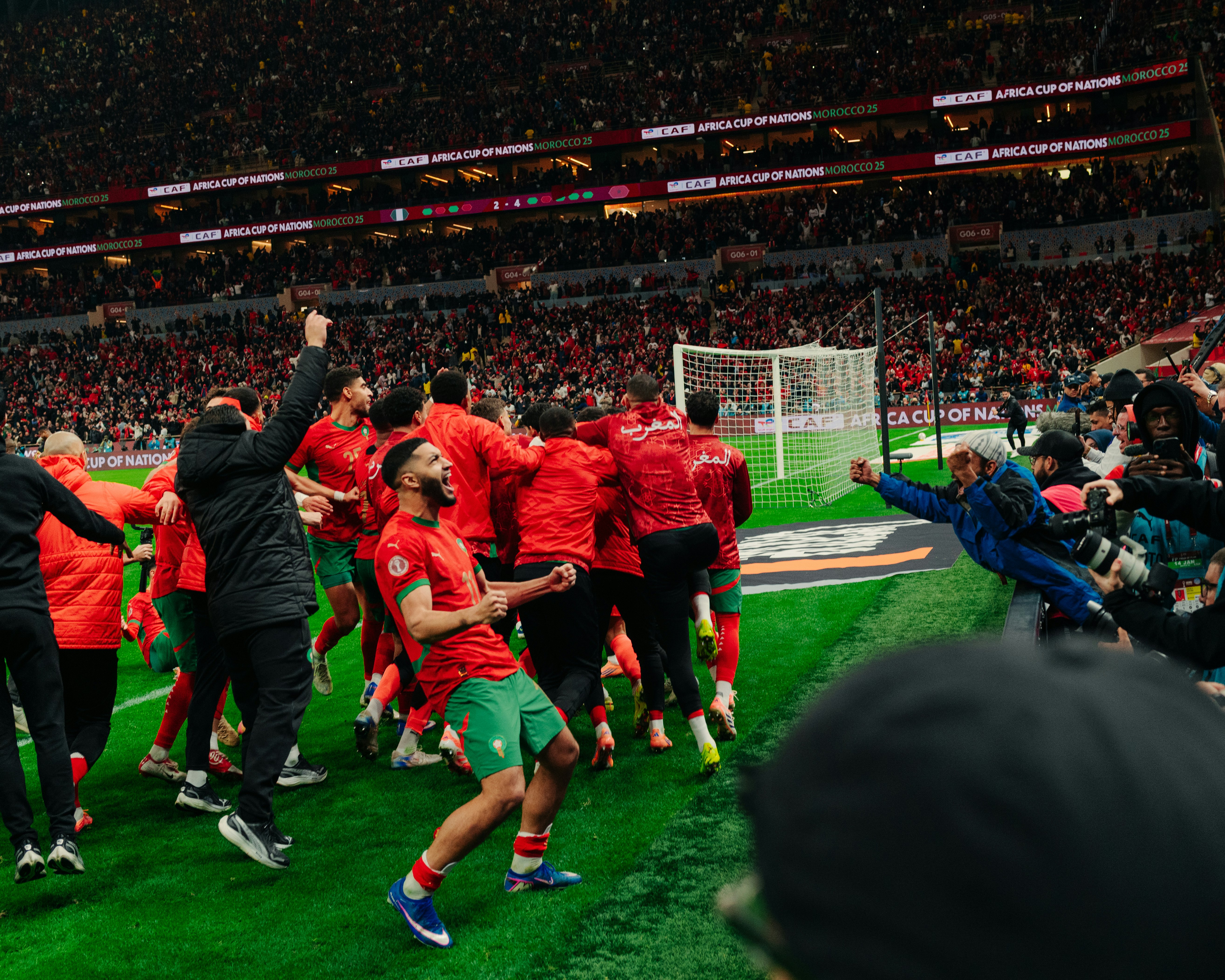 Morocco men’s national team celebrates after winning a penalty shootout at the 2024 Men’s Africa Cup of Nations semi-final.