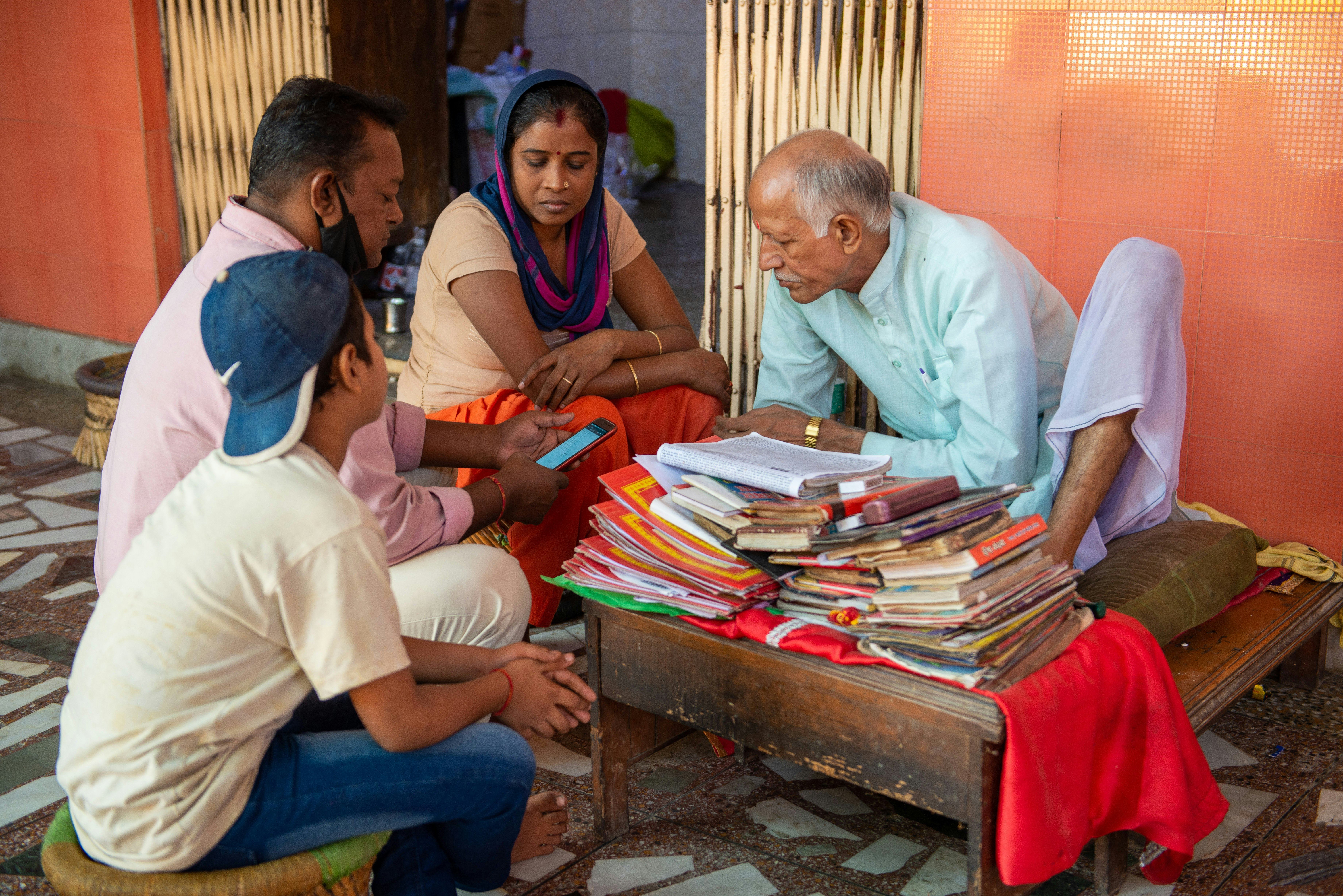 A family consulting a Jyotish astrologer in Delhi, India.