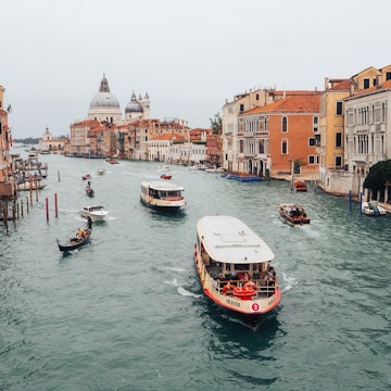 Venice, Italy-18.10.2023: Stunning view from Ponte dell'Accademia bridge on busy traffic in the Grand canal. Low cloudy sky., License Type: media, Download Time: 2025-07-01T20:30:48.000Z, User: lonelyplanetmedia, Editorial: true, purchase_order: 65050 - Digital Destinations and Articles, job: Global Publishing WIP, client: App, other: Pia Peterson Haggarty