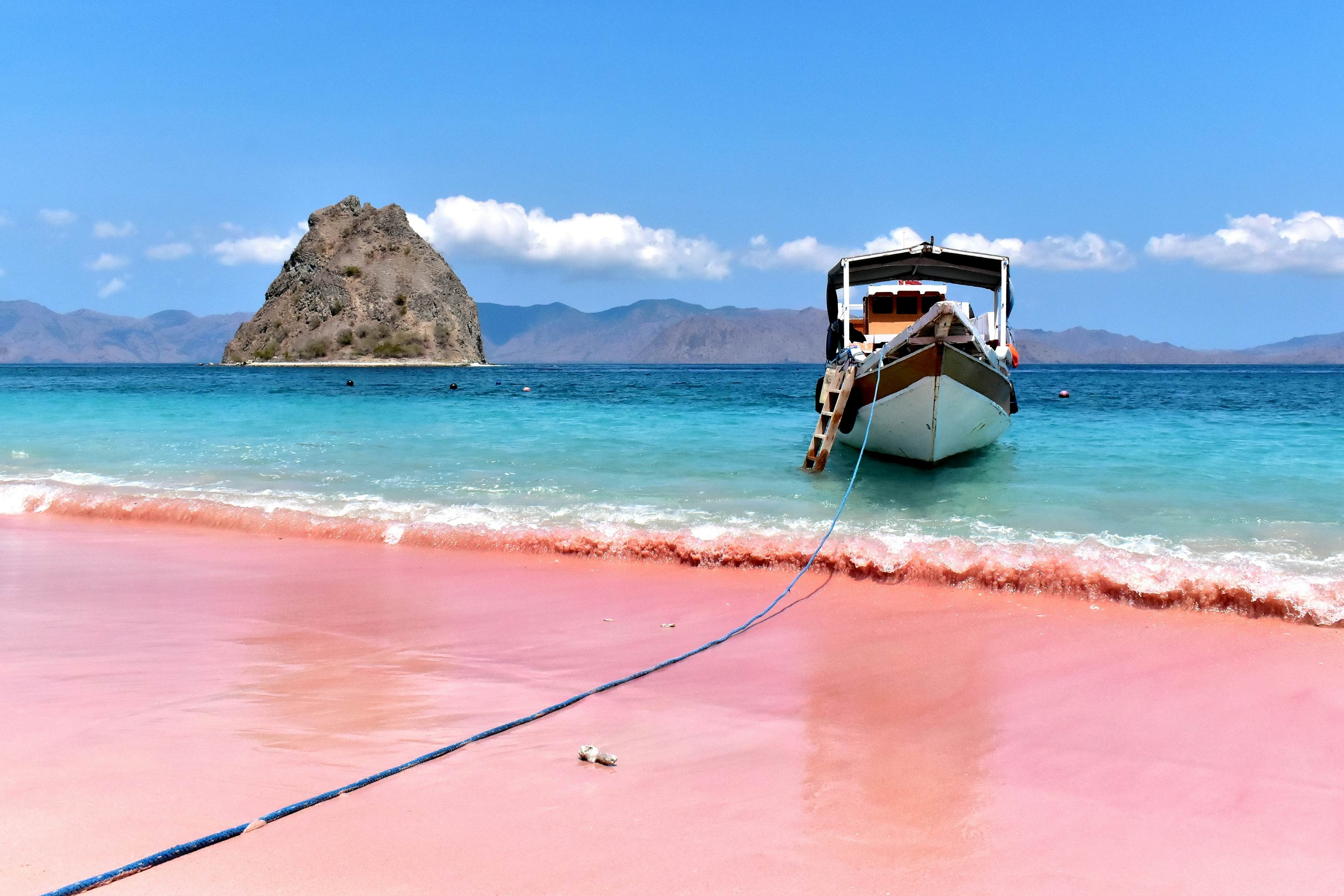 Pink beach with clear turquoise water and boat on Padar island near Komodo island, License Type: media, Download Time: 2026-03-08T17:57:23.000Z, User: bhealy950, Editorial: false, purchase_order: 65050 - Digital Destinations and Articles, job: Lonely Planet Online Editorial, client: Best alternatives to Bali, other: Brian Healy