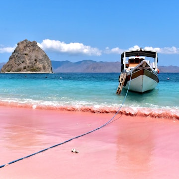 Pink beach with clear turquoise water and boat on Padar island near Komodo island, License Type: media, Download Time: 2026-03-08T17:57:23.000Z, User: bhealy950, Editorial: false, purchase_order: 65050 - Digital Destinations and Articles, job: Lonely Planet Online Editorial, client: Best alternatives to Bali, other: Brian Healy