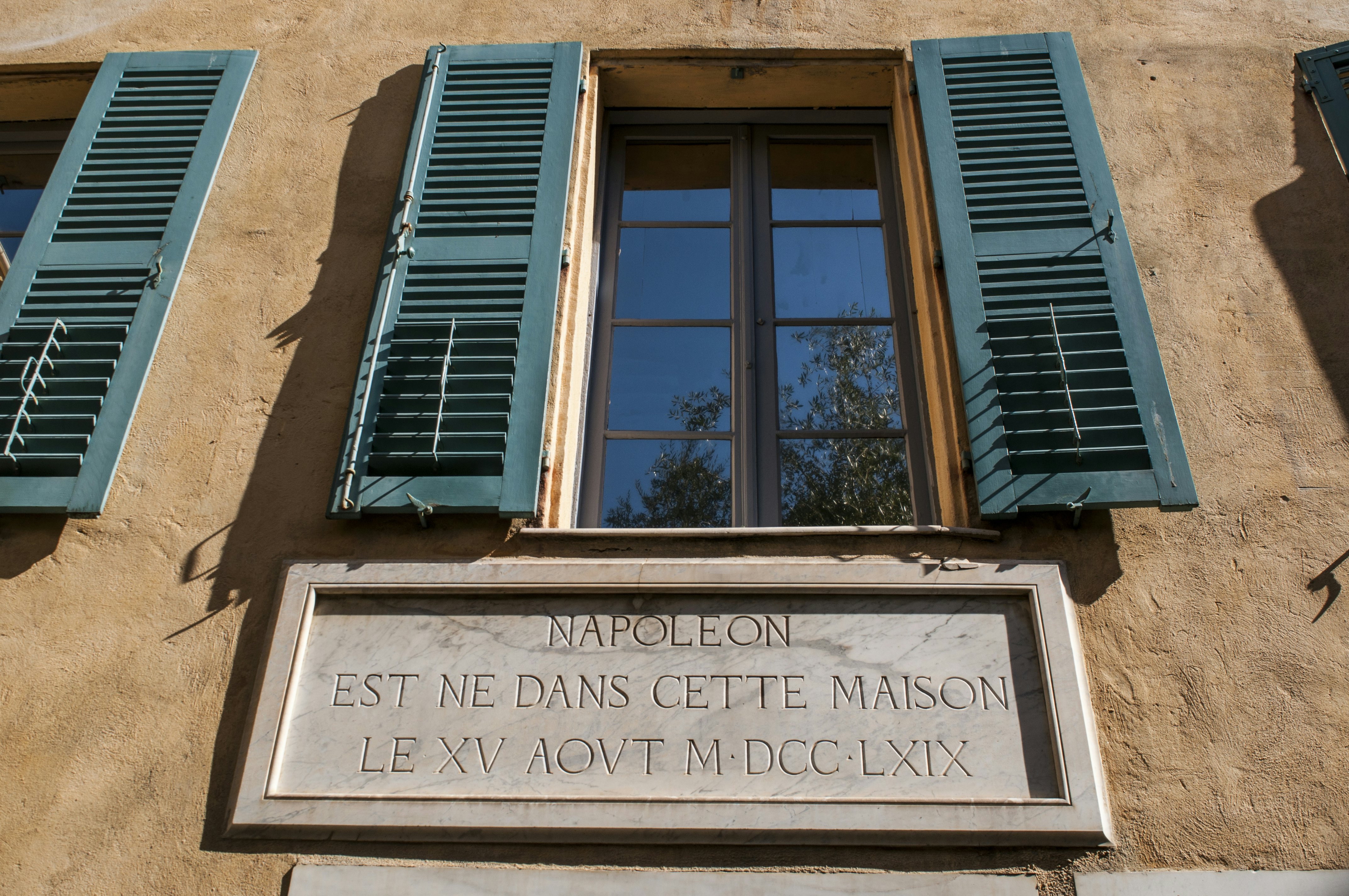 A plaque marking the birthplace of Napoléon at the Maison Bonaparte in Ajaccio, Corsica, France.