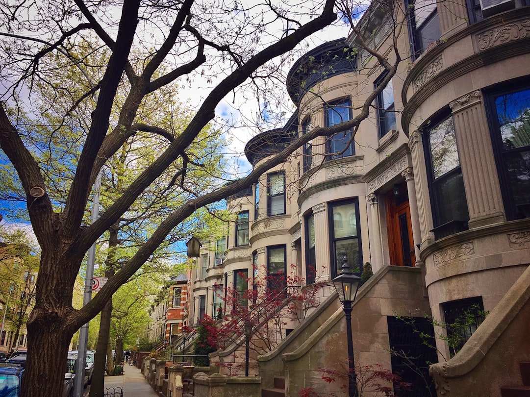 19th-century brownstones in Park Slope, Brooklyn during springtime on a sunny day