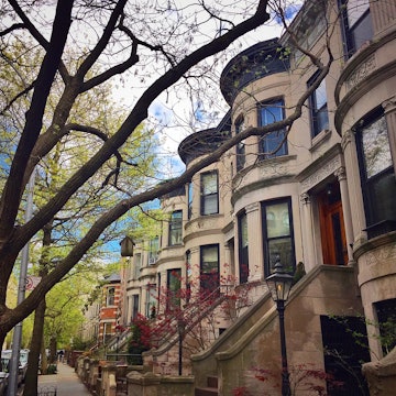 19th-century brownstones in Park Slope, Brooklyn during springtime on a sunny day