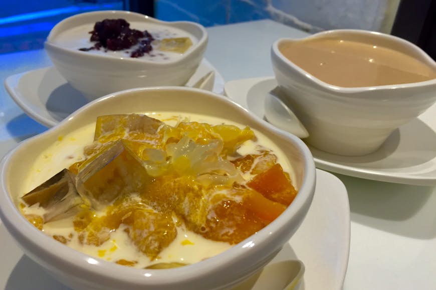 Sweet soup: mango pomelo sago, cashew, tofu pudding with red bean paste. Image by Piera Chen / Lonely Planet