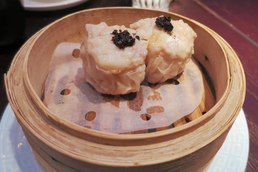 Prawn siu mai are a classic dim sum dish. Image by Megan Eaves / Lonely Planet