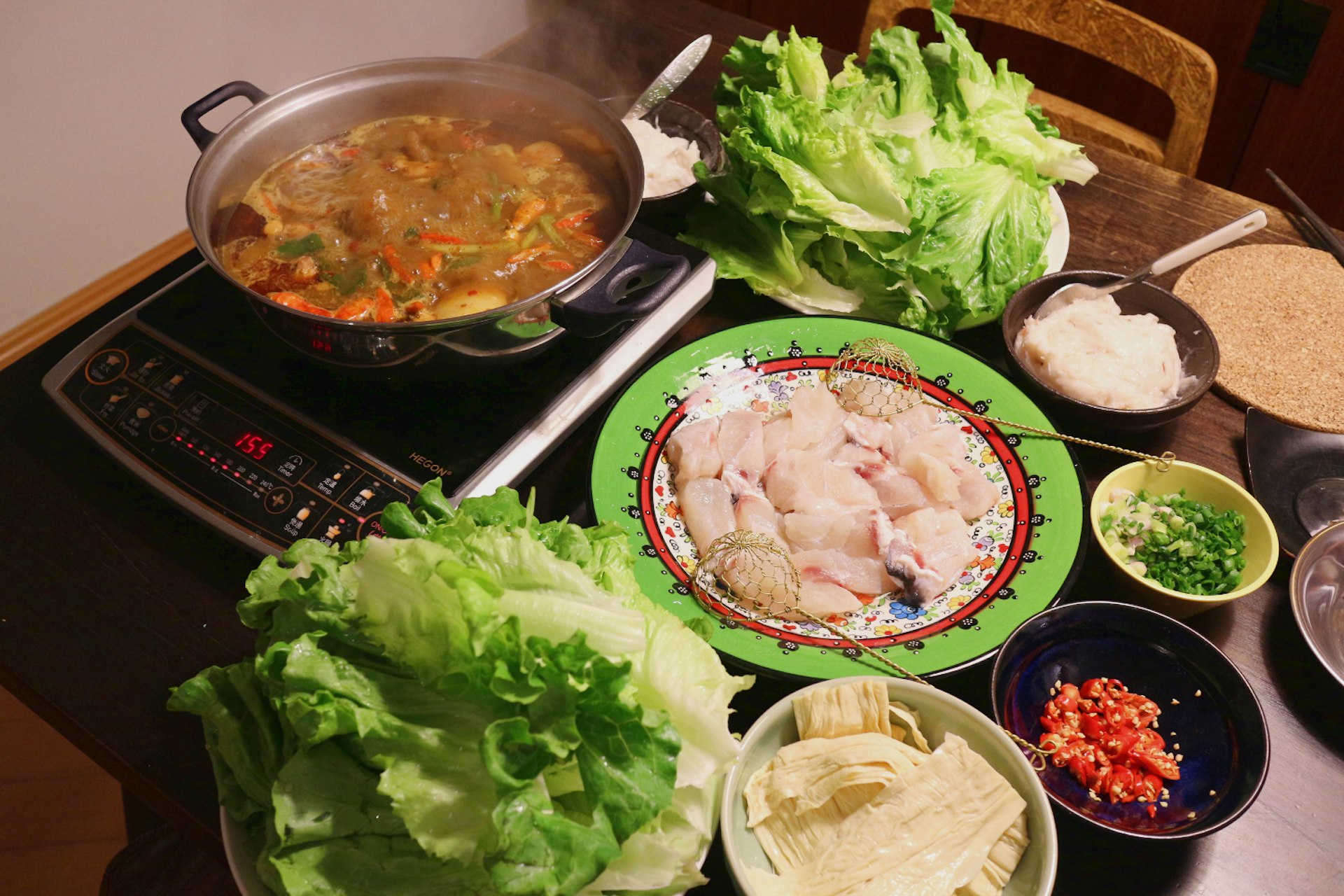 Spicy hotpot with all the condiments. Image by Piera Chen / Lonely Planet