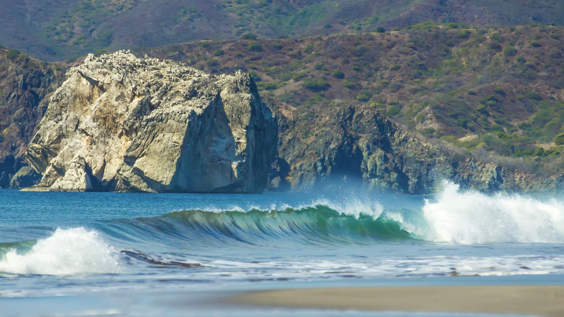 Features - The paradise surf beach of Playa Naranjo and Witch’s Rock in the Santa Rosa National Park in Guanacaste, Costa Rica