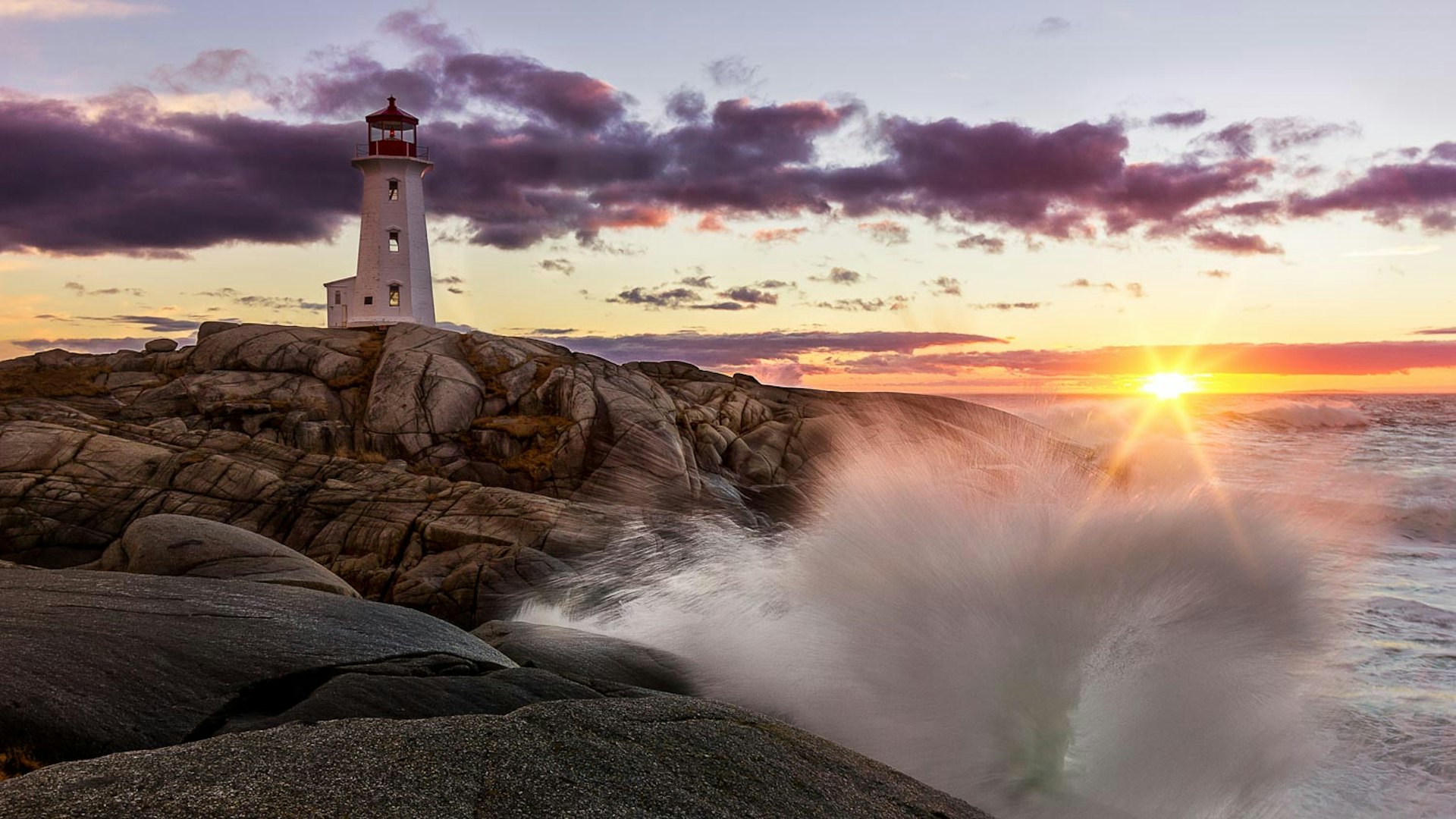 Waves crashing beneath the lighthouse at Peggy's Cove © Johnathan Rhynold / 500px 